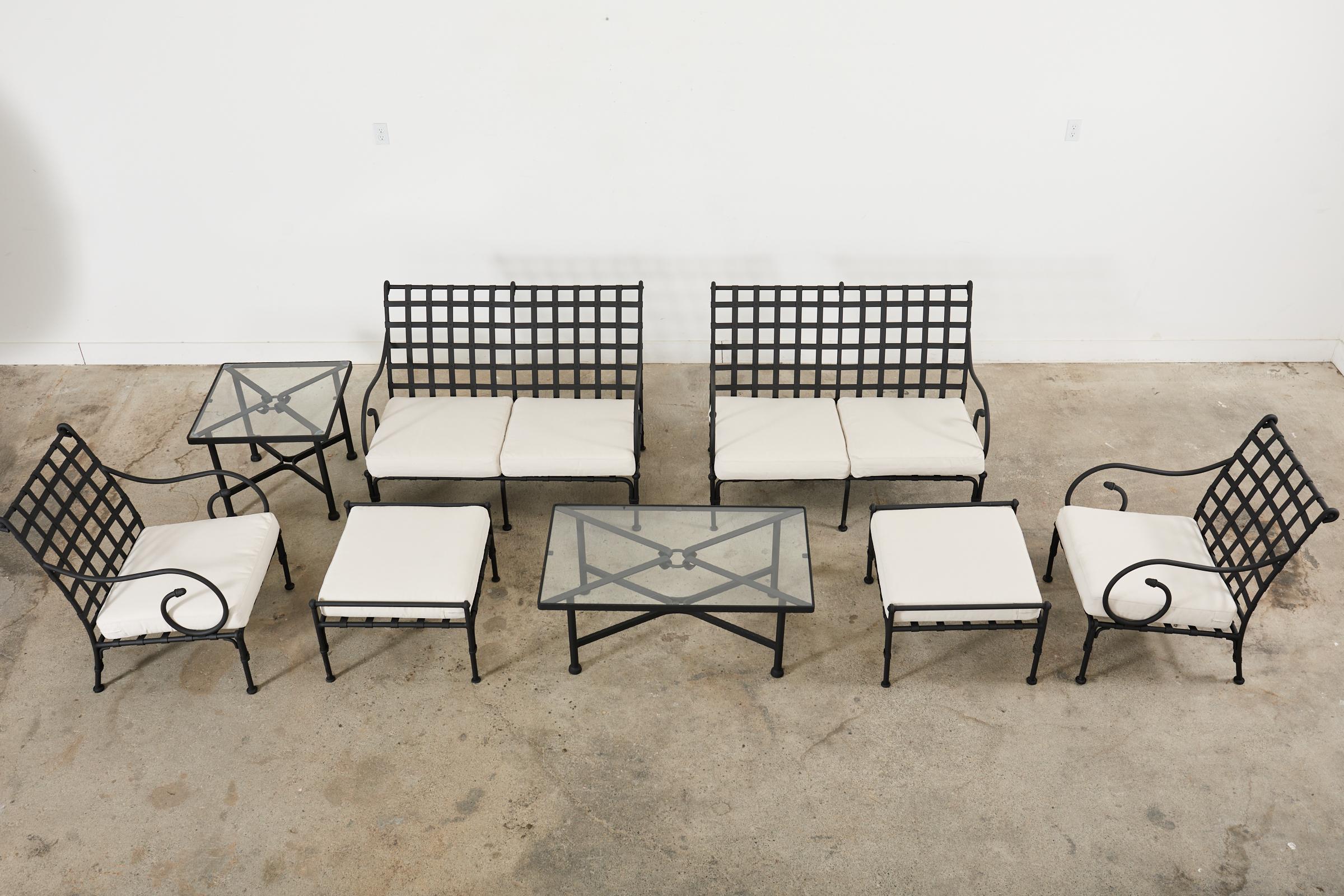 Grand set of rare French neoclassical style patio and garden furniture suite hand-crafted by Sifas. The set consists of two settees, two lounge chairs, two ottomans, a coffee table, and one side table. The items are from the Kross collection and