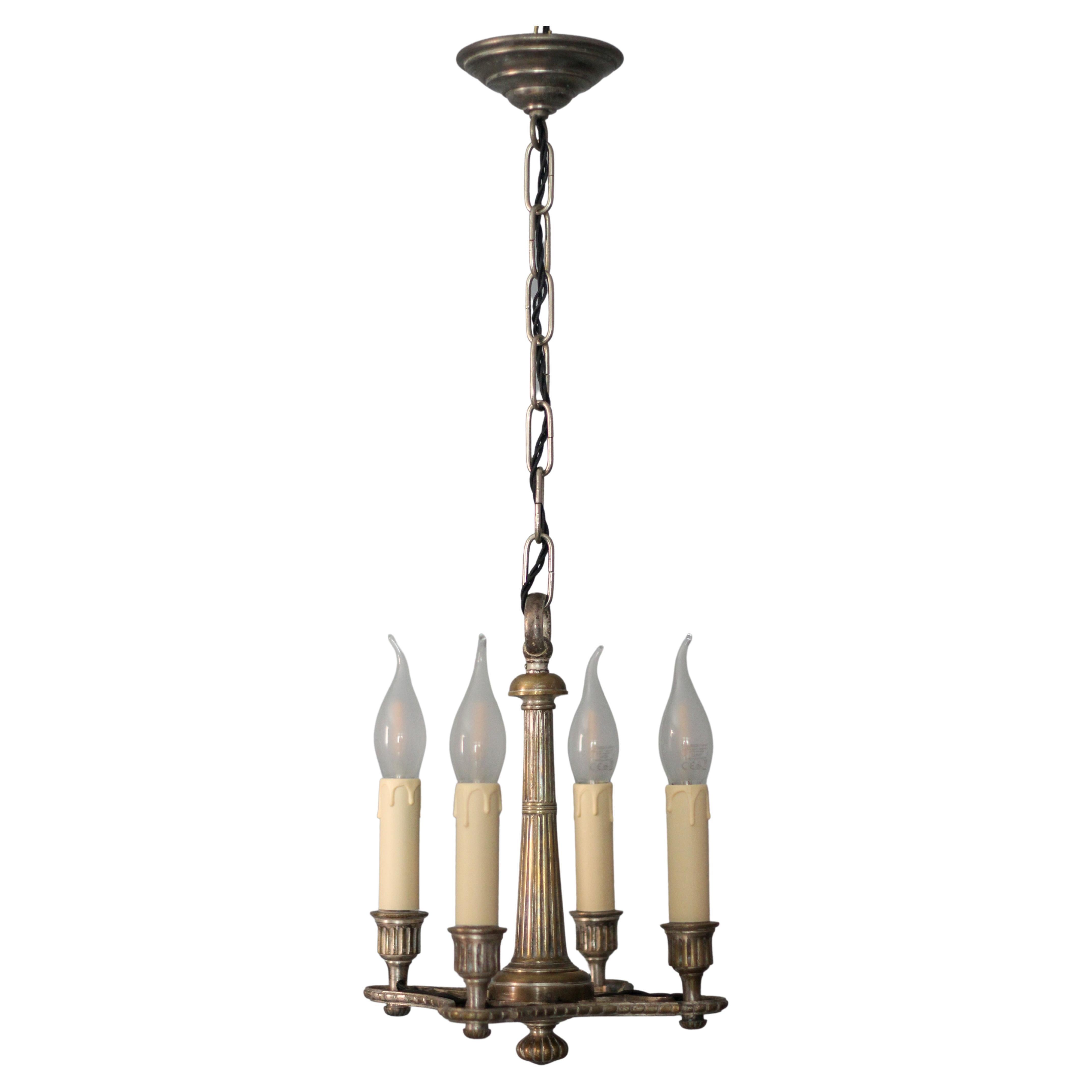 French Neoclassical Style Silver Color Brass Four-Light Chandelier, circa 1920 For Sale