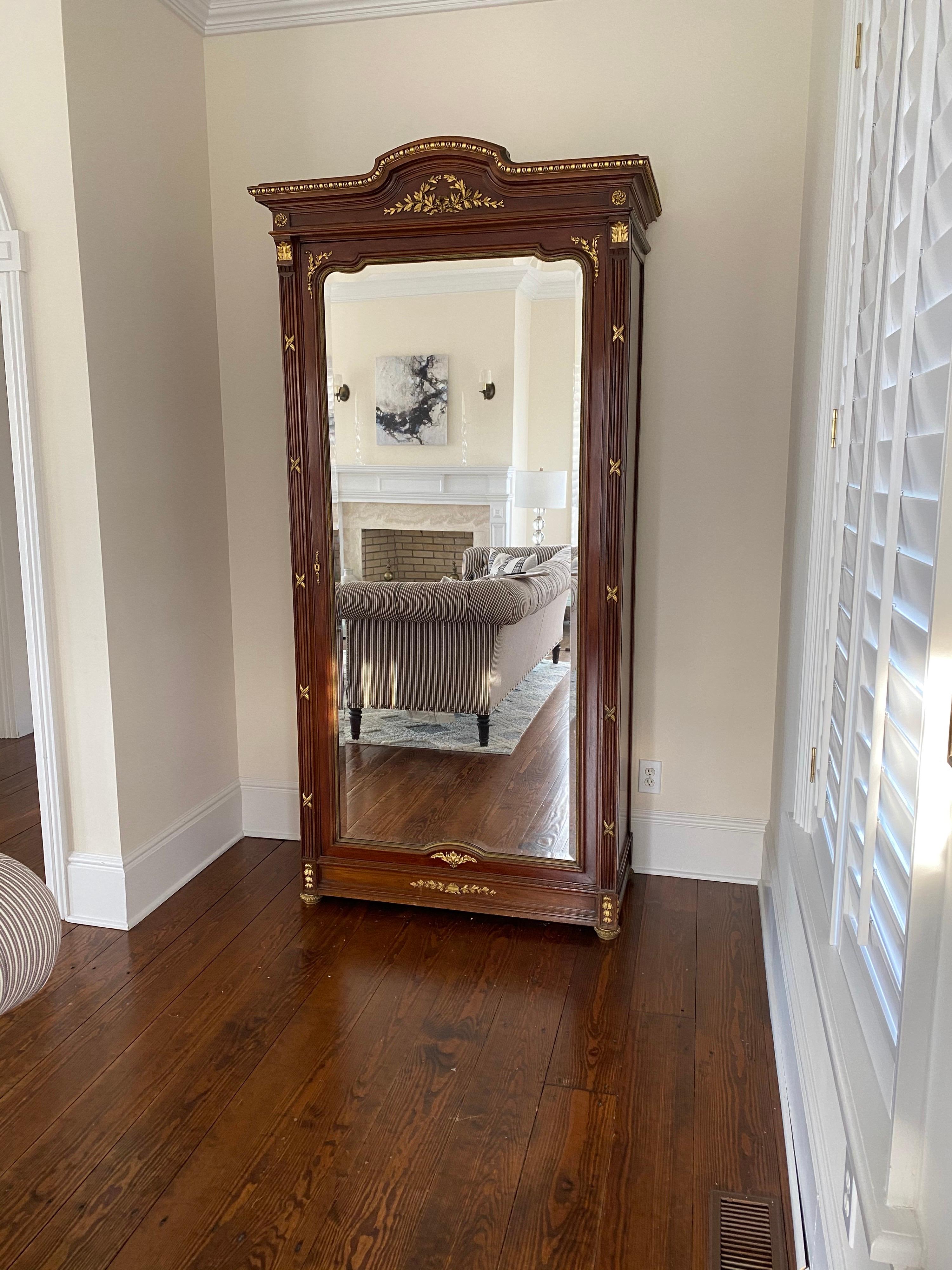 French neoclassical style tall mirrored cabinet/armoire
Beautiful reproduction, originally with legs, legs were cut off. Selling as is.
Parcel-gilt details, beveled mirror, Single door opening to three removable shelves and one bottom drawer