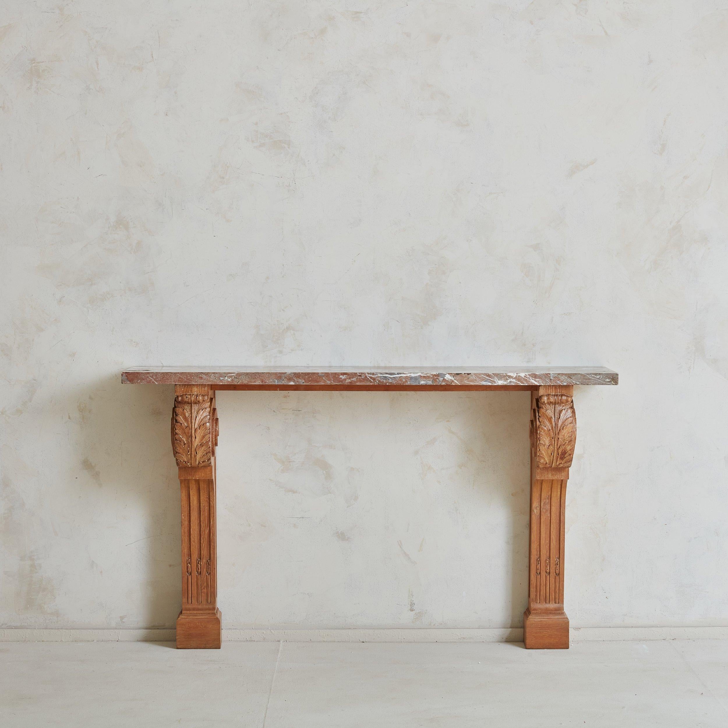 Purchased from a private residence near Avignon, France; this gorgeous hand carved wall console is attributed to Jean Charles Moreaux; a French Architect who graduated from e École des Beaux-arts de Paris in 1922. The console was originally a part