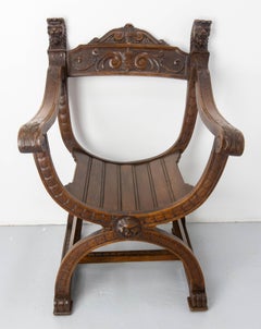 French Neogothic Chestnut Curule Armchair with Two Lionheads, French, circa 1900