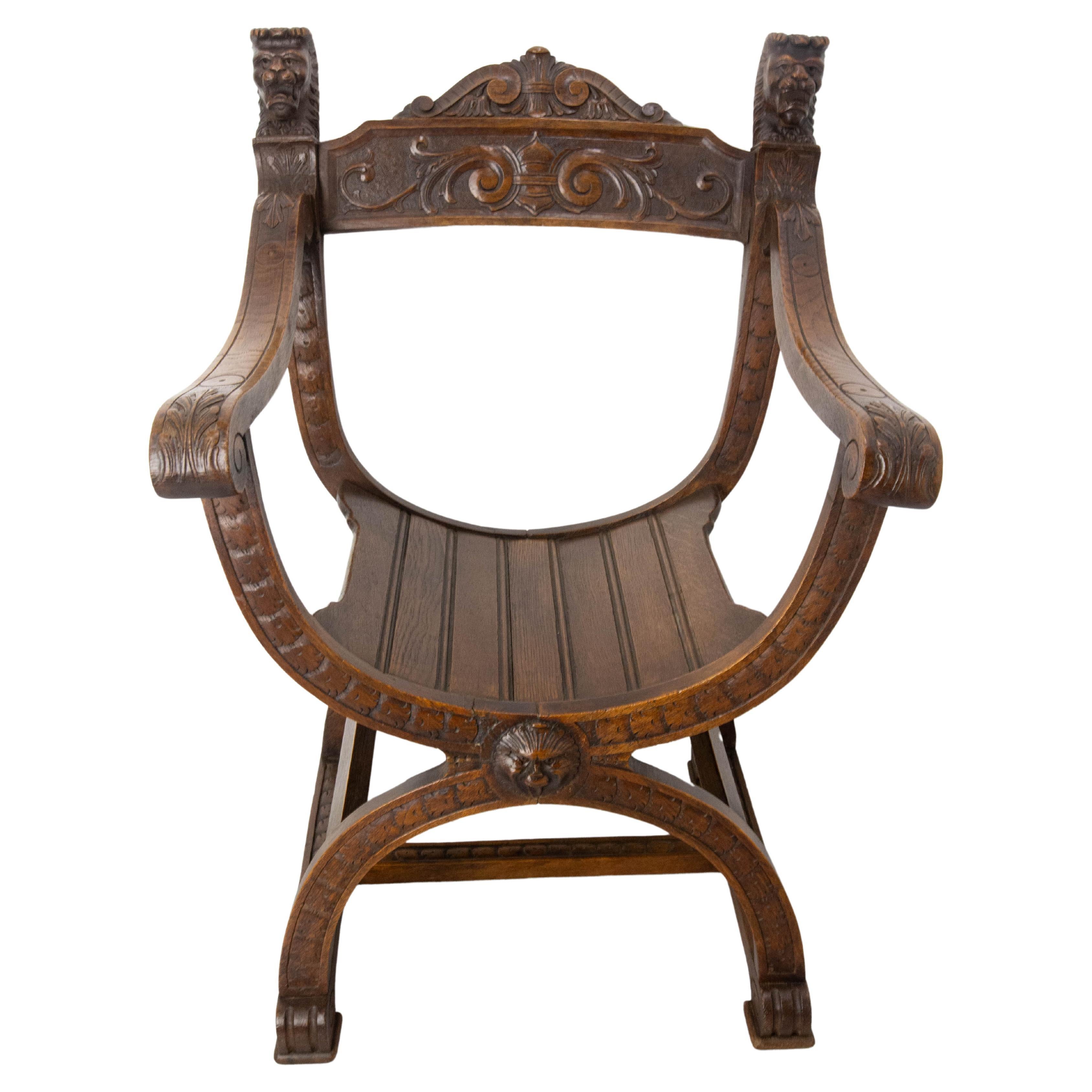 French Neogothic Chestnut Curule Armchair with Two Lionheads, French, circa 1900 For Sale