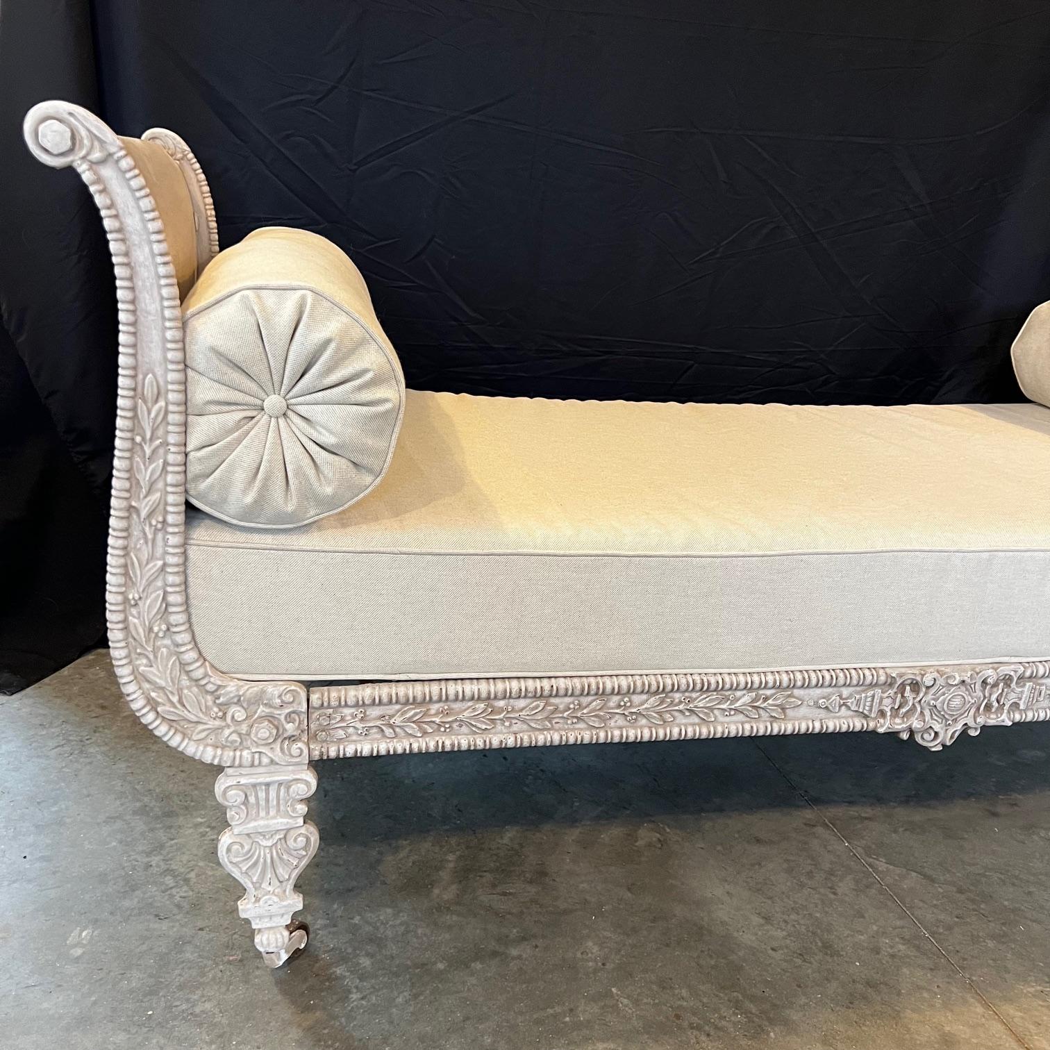 Classic French Louis XVI Neoclassical French Empire daybed newly reupholstered with modern plush bolster pillows. Bed frame is solid painted iron turn of the century from France and cushions are new. Will add elegance to any room in the home. Found