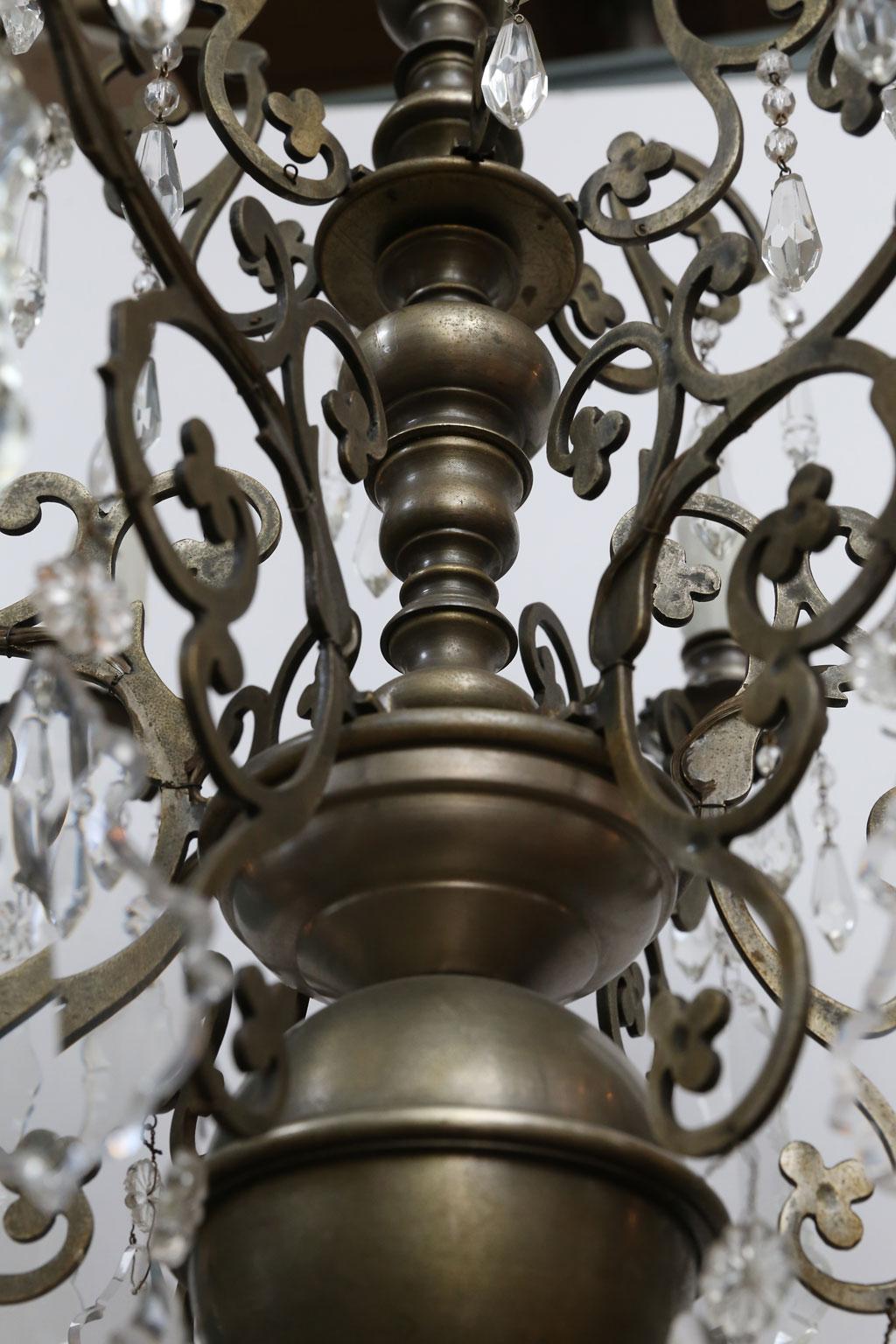 French nickel on bronze chandelier with cut-crystal prism pendants. Six nicely detailed flat silhouette-like arms are decorated in a trefoil motif. Newly wired for use within the USA. Each light accommodates a candelabra-size bulb. Include chain and