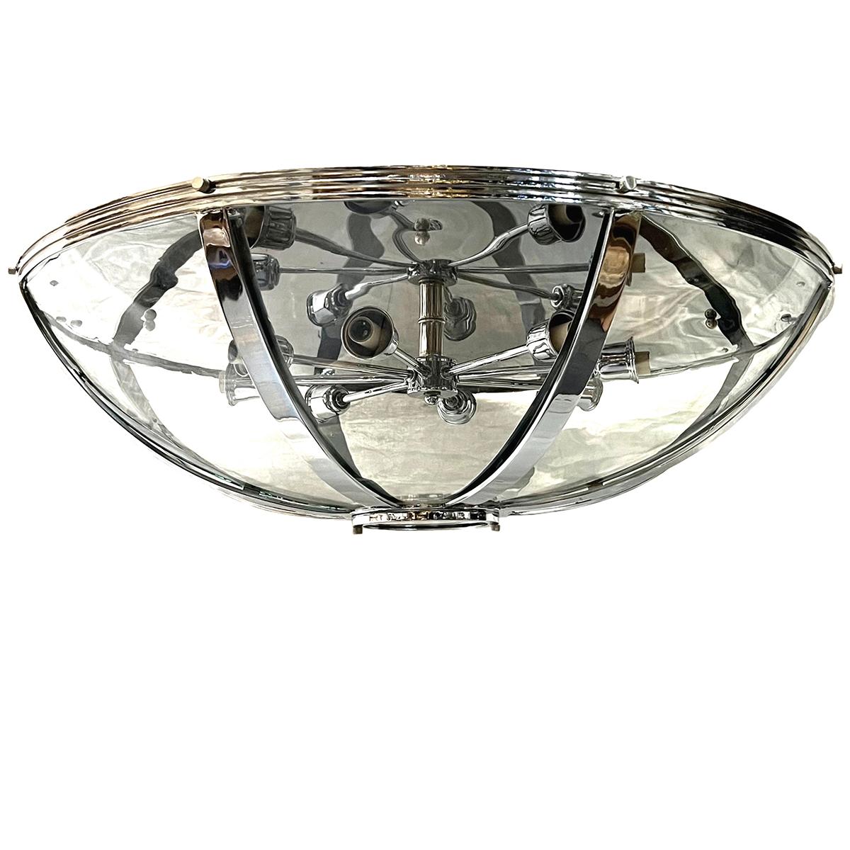 A circa 1960's French nickel plated light fixture with eight interior candelabra lights.

Measurements:
Diameter: 30
