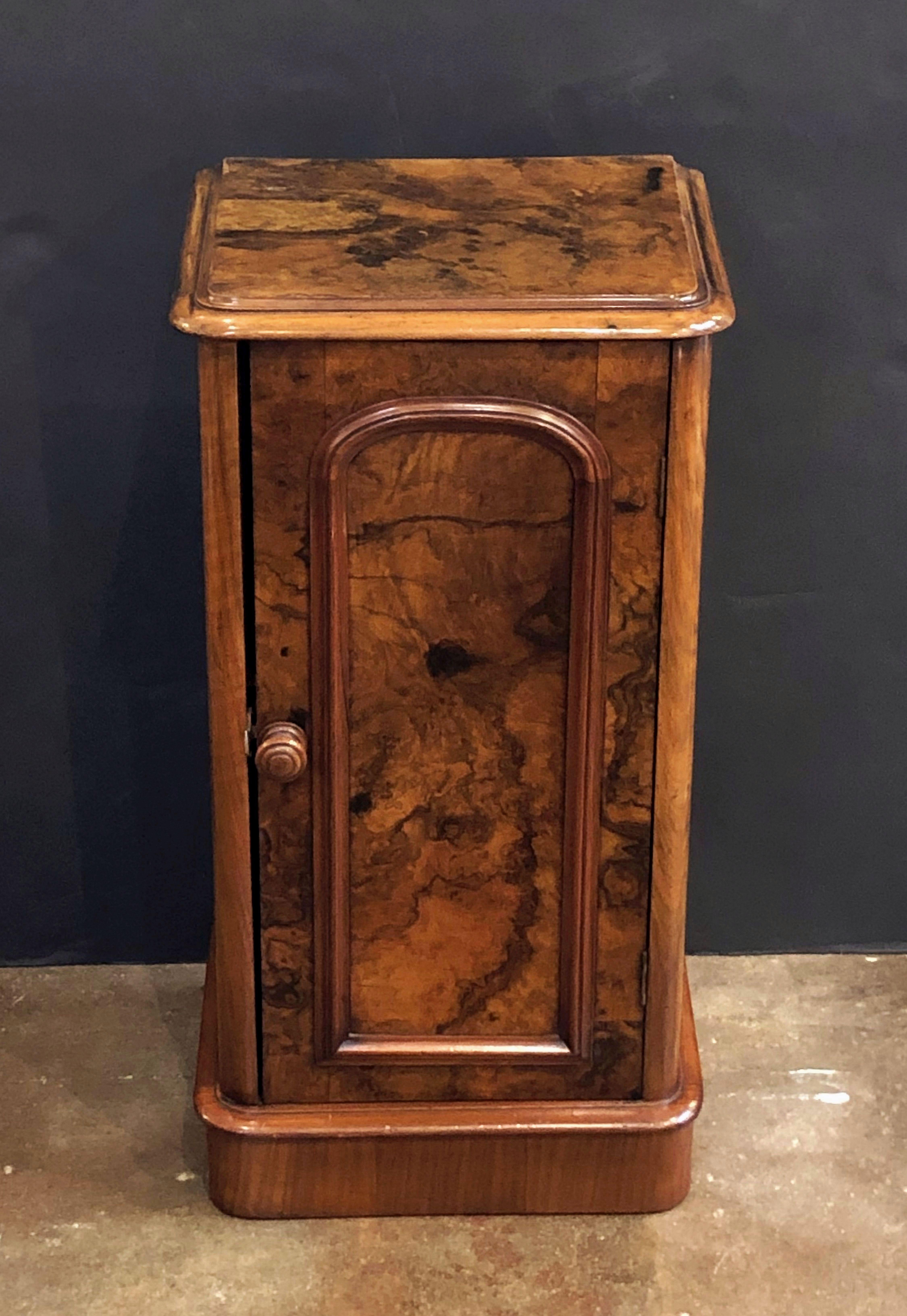 A handsome French nightstand or end (side) table of burr walnut, with moulded top over a cabinet door, opening to interior with shelf, and resting on a moulded plinth.

Dimensions: H 29 1/2 inches x W 15 1/2 inches x D 12 1/2 inches.

 