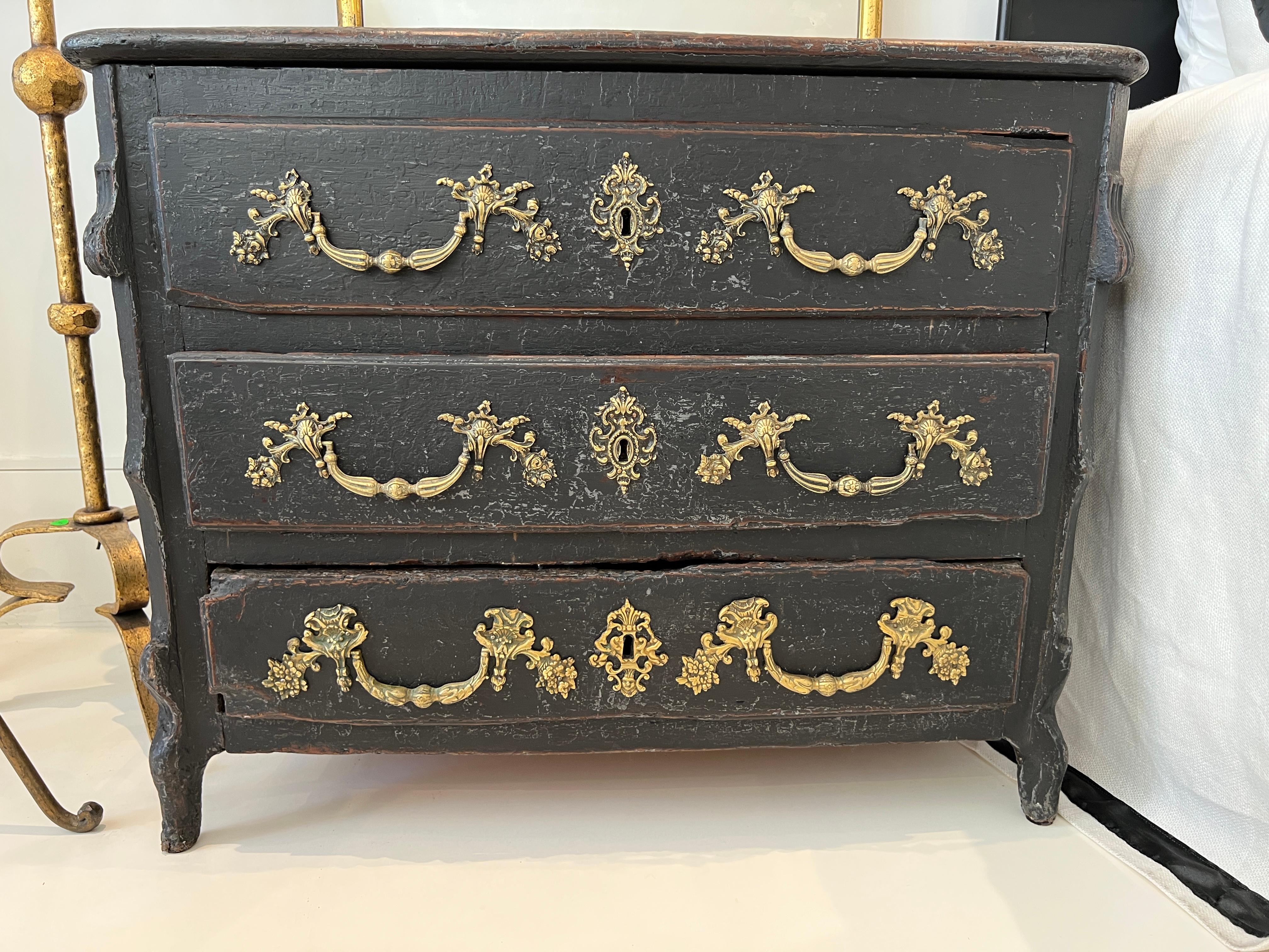 Very desirable black chest or commode with stunning bronze pulls. A strong statement piece in any decor.