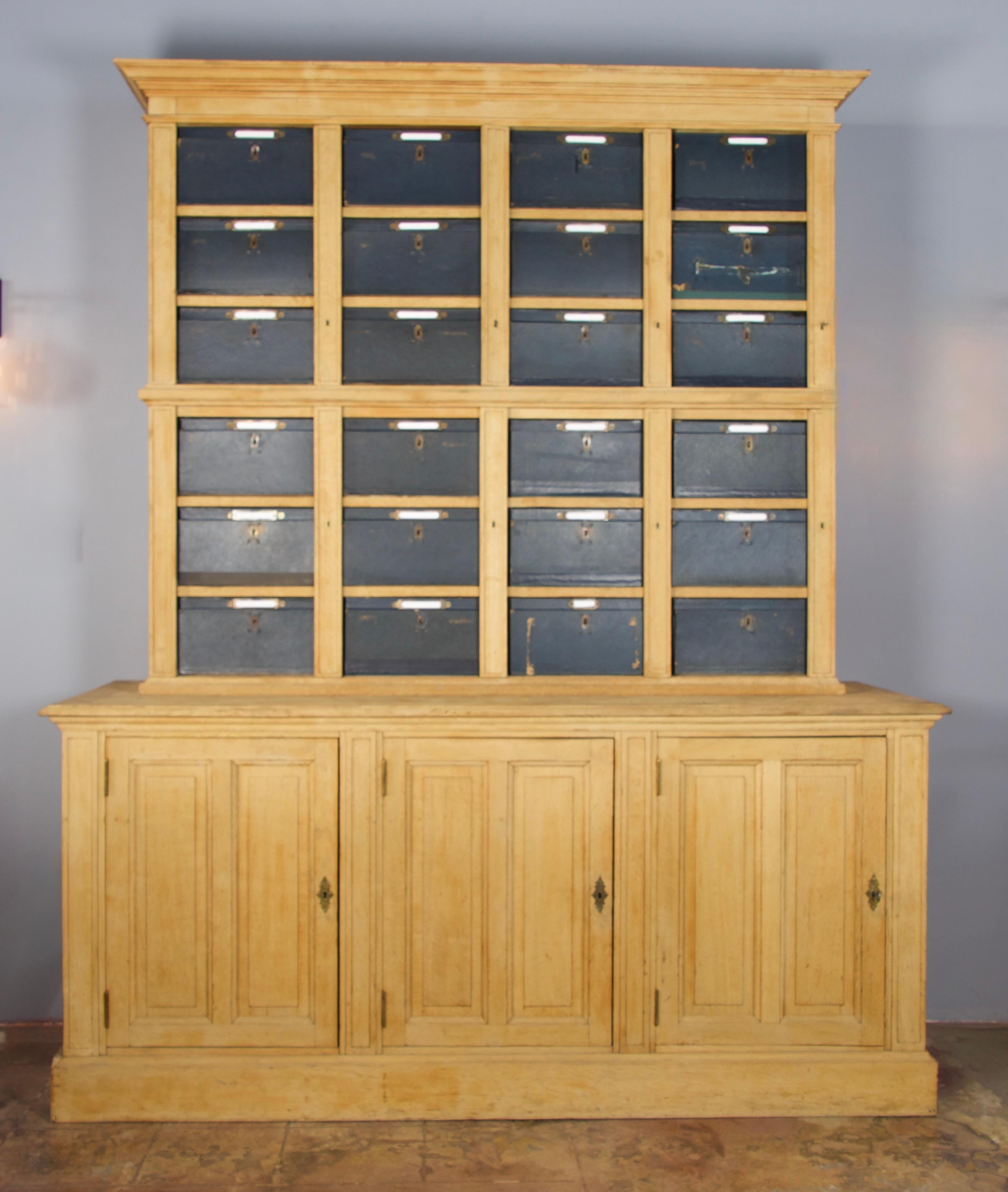 This beautiful and rare piece came from a Parisian lawyer office to hold the confidential files.
French oak cabinet with 24 removable cardboard drawers/boxes with brass latches (box size: W 14