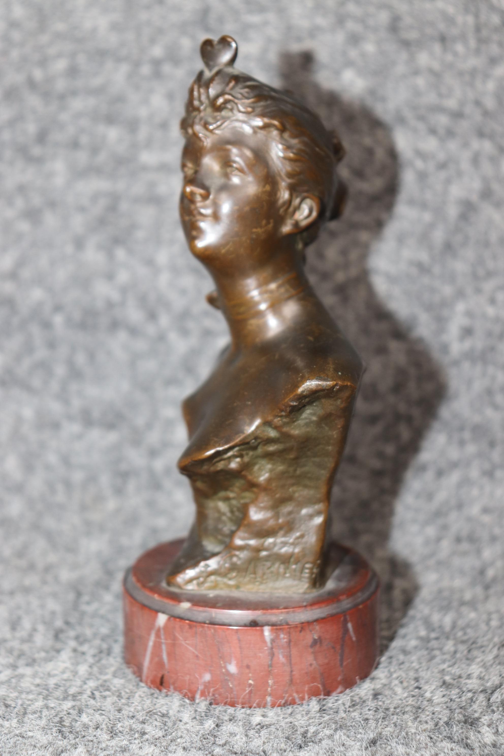 Dimensions - H: 6 1/2in W: 3 1/4in D: 2 3/4in 

This French Nouveau Style Bronze Bust On Marble Base of Lady Signed J. Garnier is truly a lovely example of french decorative arts. If you look at the photos provided you will see the quality within