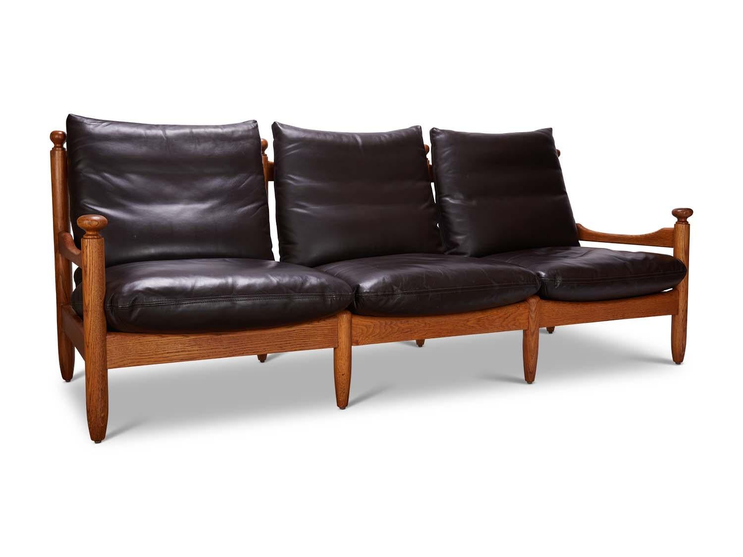 French oak and black leather sofa.