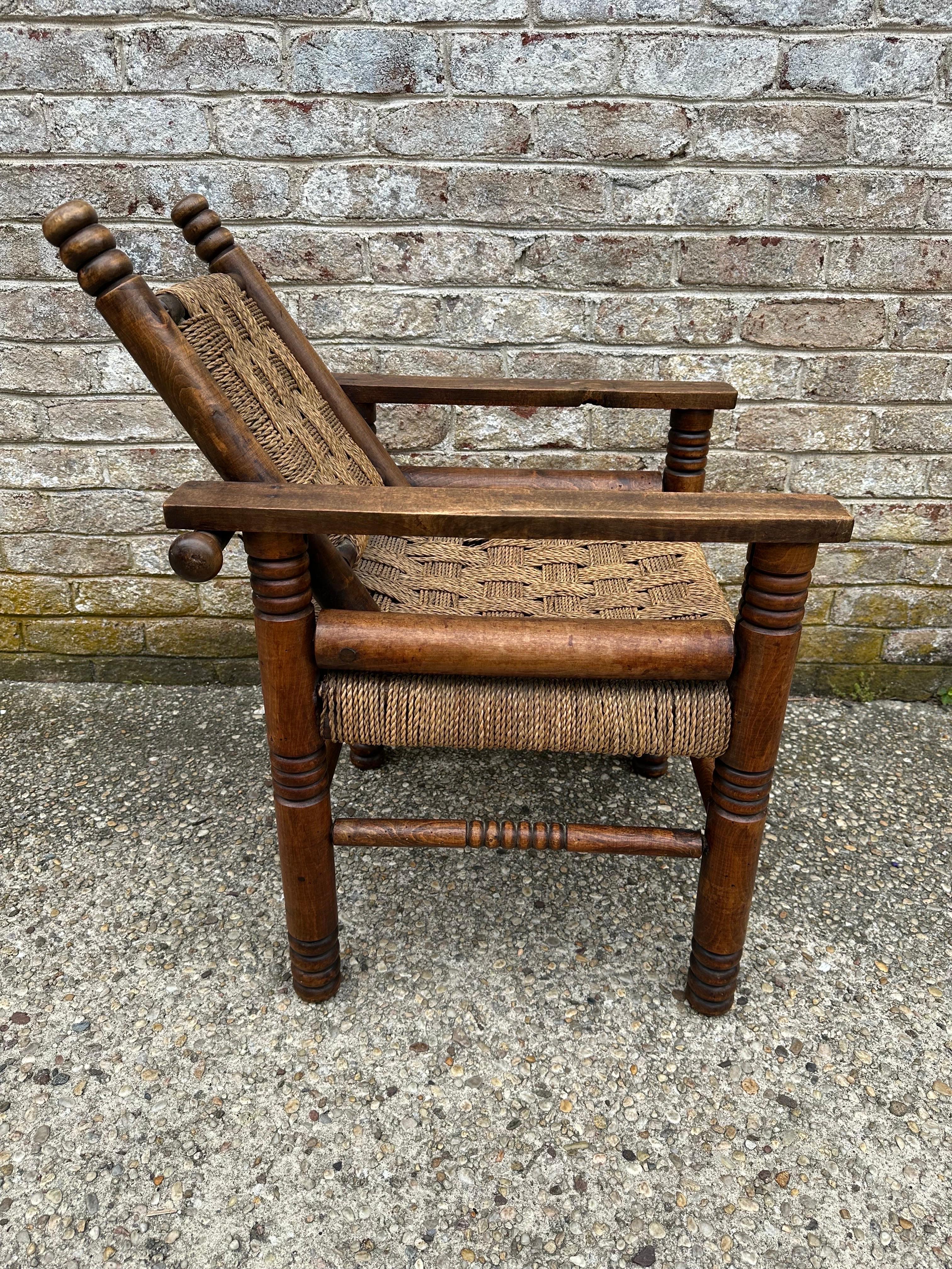 Charles Dudouyt armchair with woven rope seat and back....