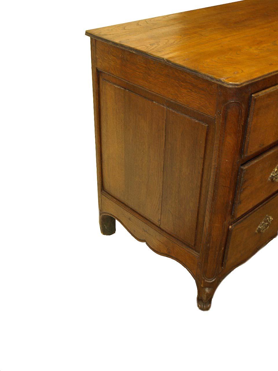 French oak and elm commode, the elm top with beautiful grain and a nice faded patina; raised panel sides, the front corners are rounded and surrounded by a raised carved molding, the drawers with overlapping beaded edges feature rococo brass pulls,