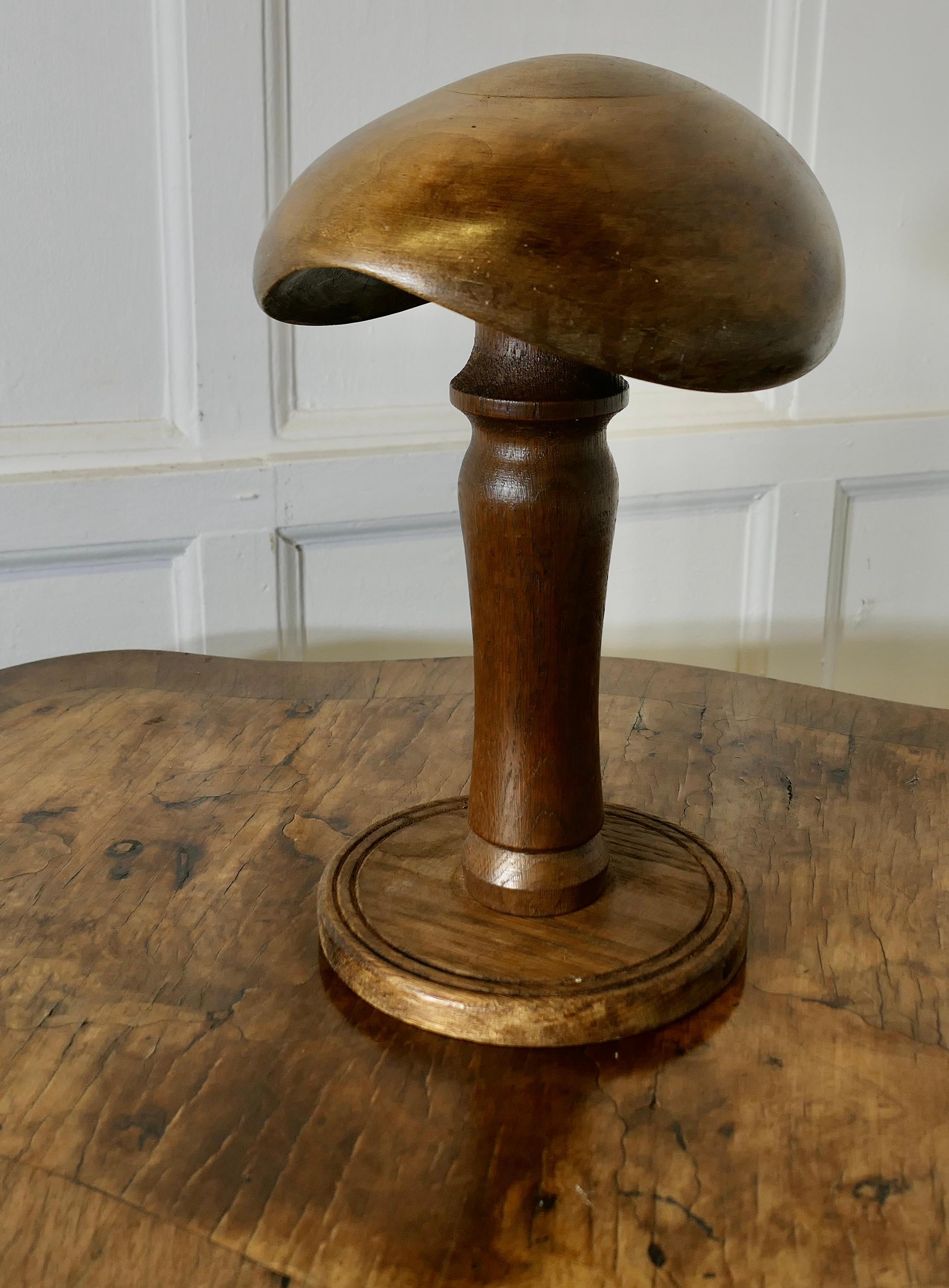 French Oak and Walnut Beret/Flat Cap Milliners Form

This is the Hat Block of a French Artiste Flat Cap much loved by the French it  is a superbly shaped piece and very attractive, the hat form is made in walnut and the stand is turned in oak

The