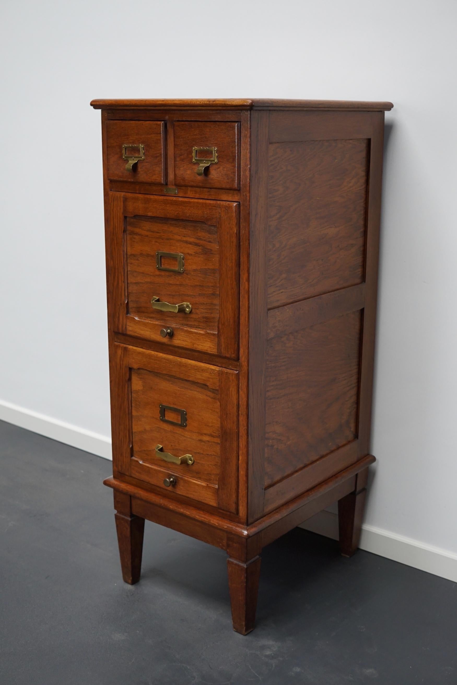 Very nice French oak filing cabinet with two small and two large drawers with brass hardware. It is very well made and in a good antique condition. The interior dimension of the drawers are: D W H 32 x 15 x 5 / 8 cm and 45 x 33 x 12 / 26 cm.
