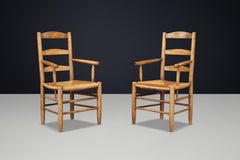 French Oak Armchairs with Rush Seats in the Style of Charlotte Perriand, France
