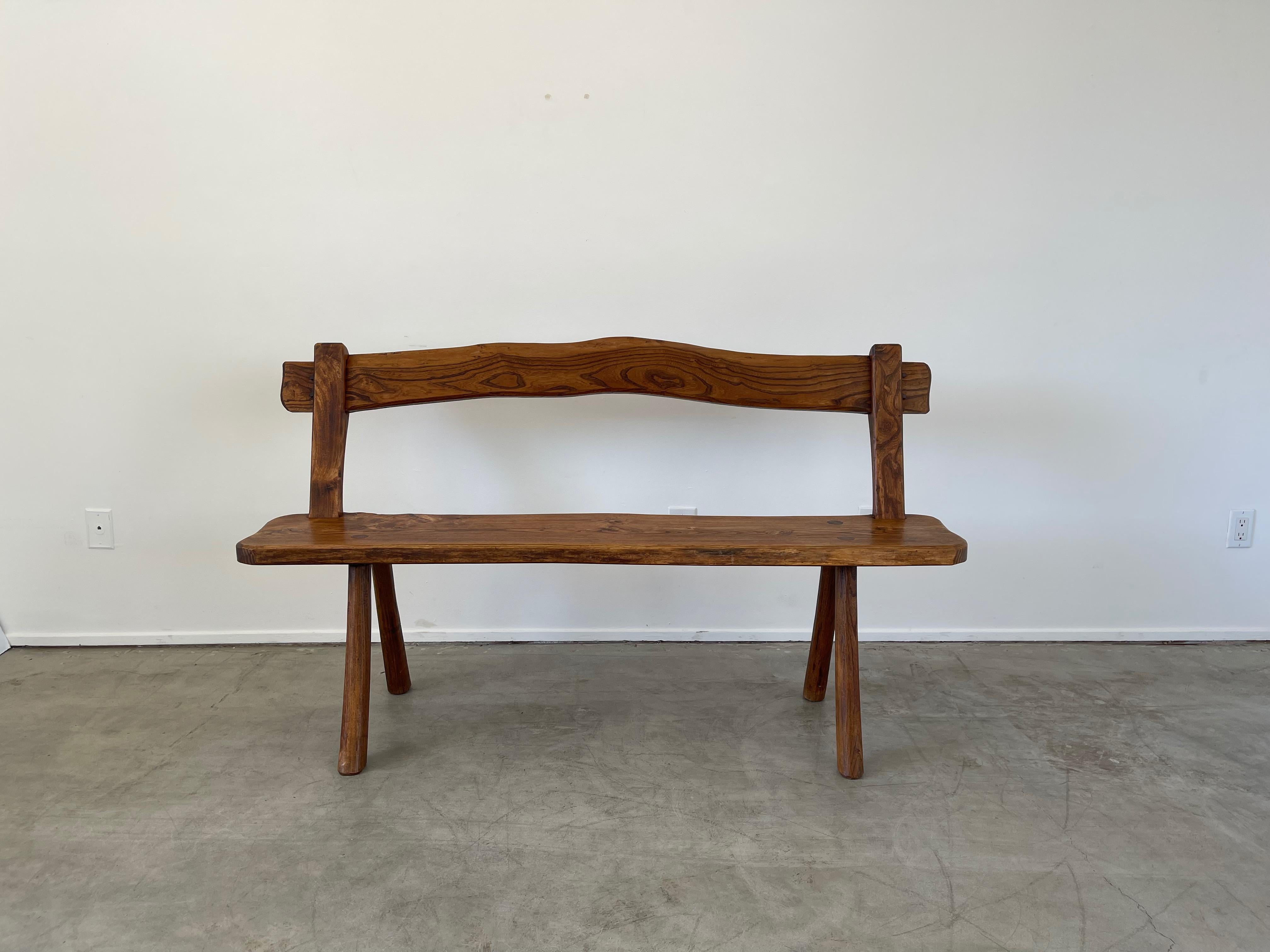 French oak bench with curved back and brutalist construction. 
Wonderful patina and great from all angles.