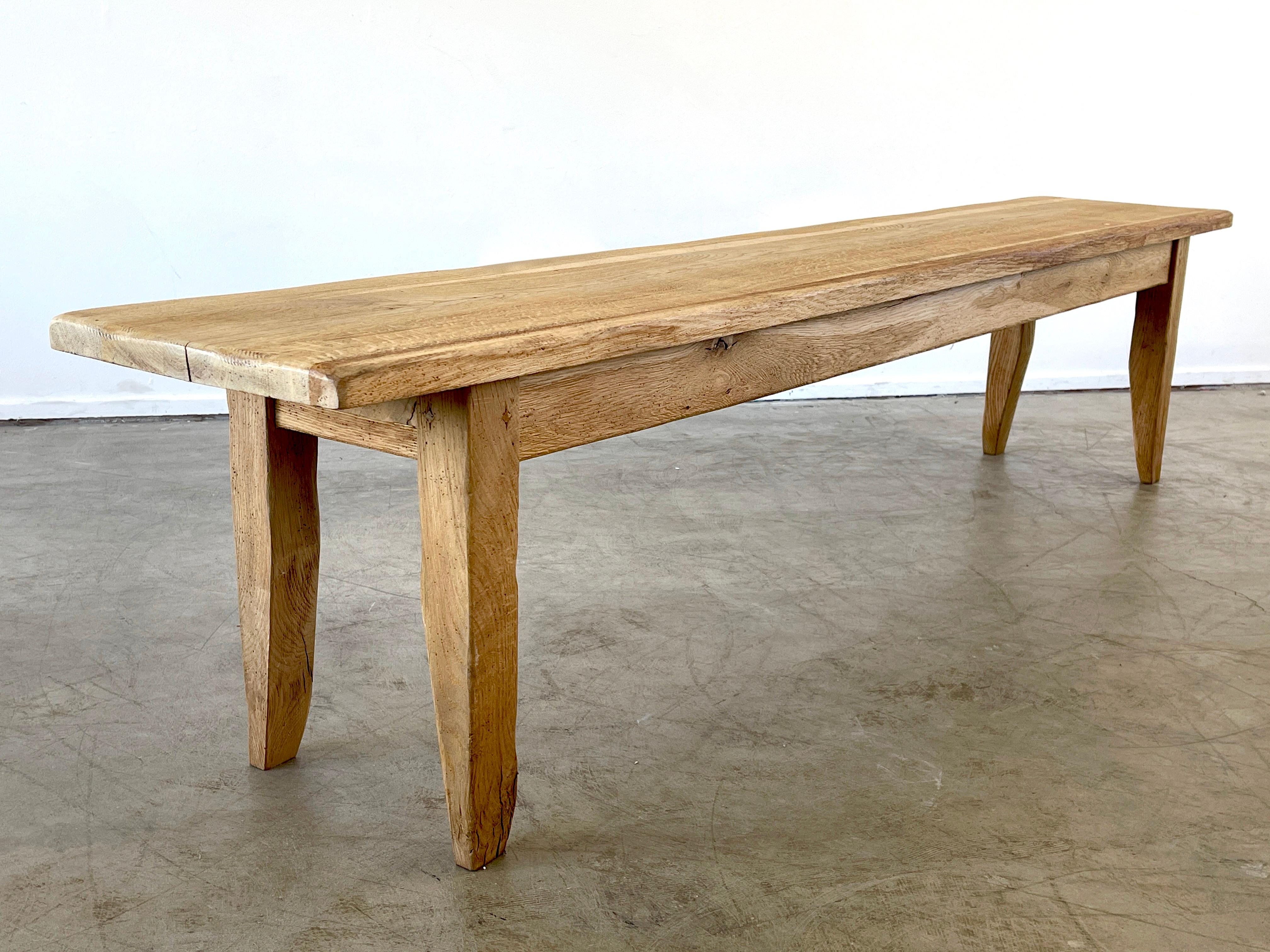 Fantastic oak bench with simple lines and angular legs. 
France, circa 1950s
Wonderful patina and wood grain