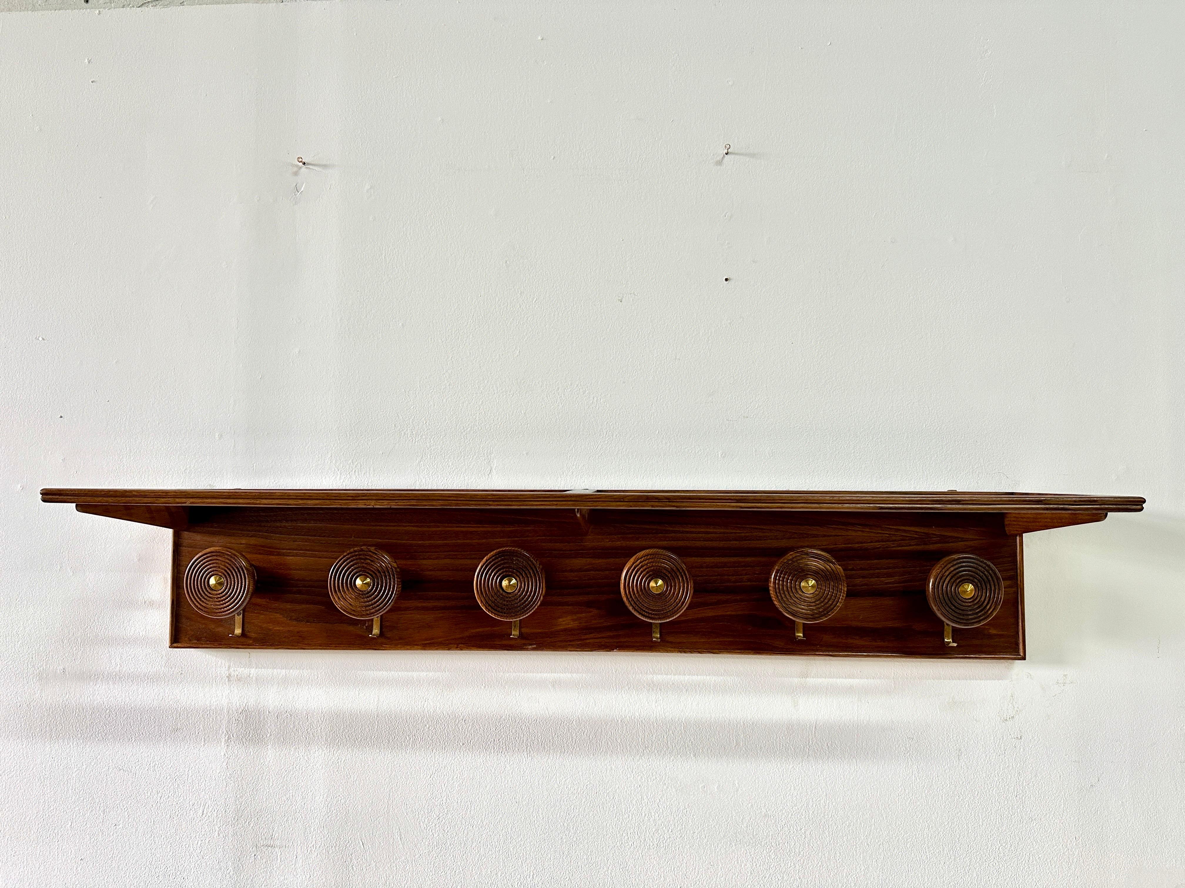 This amazingly unique wall mounted hat rack made from turned wood and brass with dowel top shelf and brass hooks for coats and scarves.  This one we have NEVER seen before and were happy to source it in France for our most discerning clientele. 