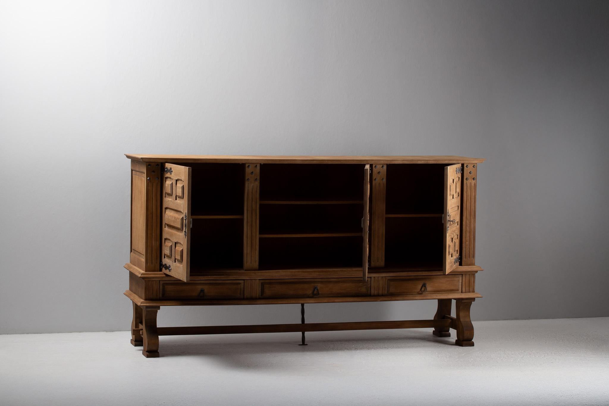 French Provincial French Oak Buffet with Carved Panels and Iron Detailing, 1940s For Sale