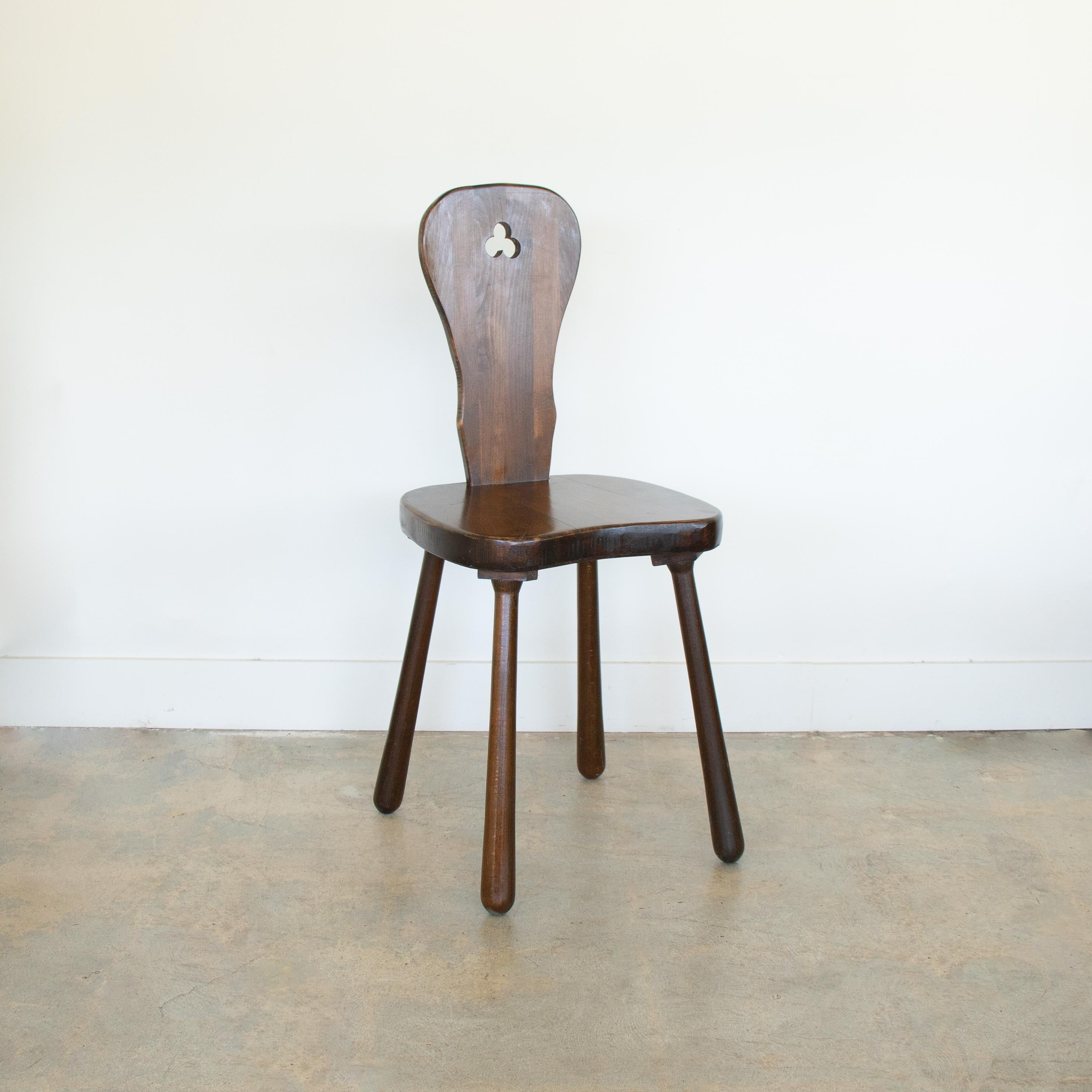 Beautiful vintage wood chair from France, 1940's. Four leg oak chair with thick carved seat. Slender wood back with decorative carved detail on back. Original finish showing great age and patina. Great statement chair. 