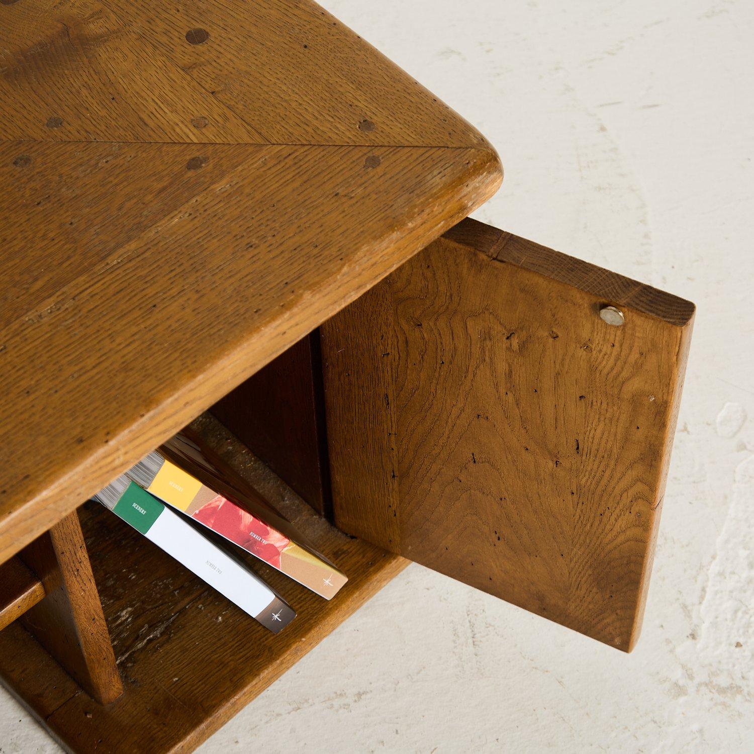 Solid French oak storage table with a central recessed platform for plants or display.

Each leg also houses a small cupboard with a useful shelf.

France 1970s

D 100cm x W 100cm x H 45cm