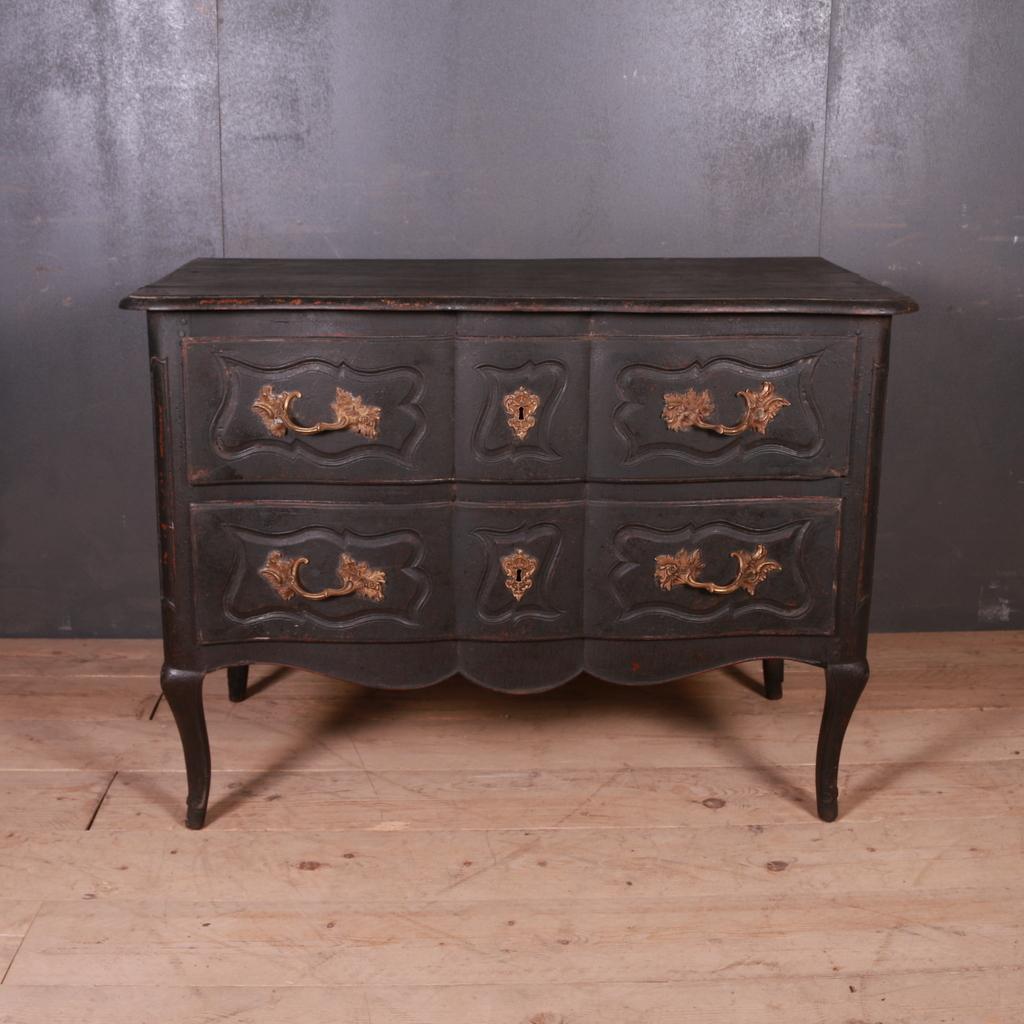 18th century painted two-drawer French oak commode, 1780.

Dimensions:
46 inches (117 cms) wide
24 inches (61 cms) deep
34 inches (86 cms) high.