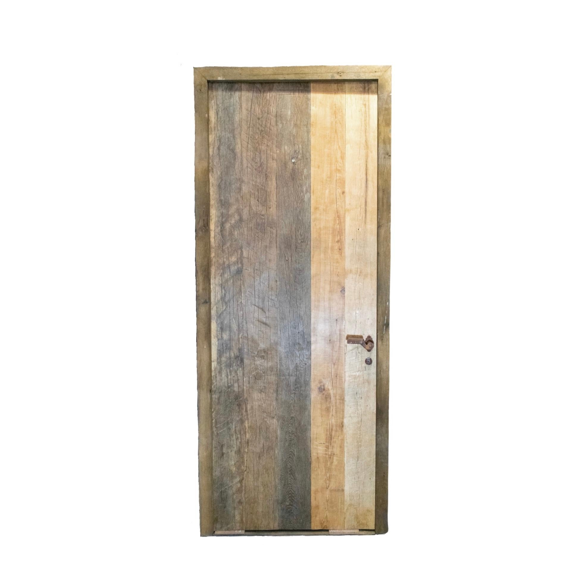 A reclaimed door made out of newly constructed Oakwood. Door Lock ready and with key. Circa, 18th century. 

Reclaimed rustic doors are doors made from used materials that have been refurbished and given a new purpose. They often have a rustic or