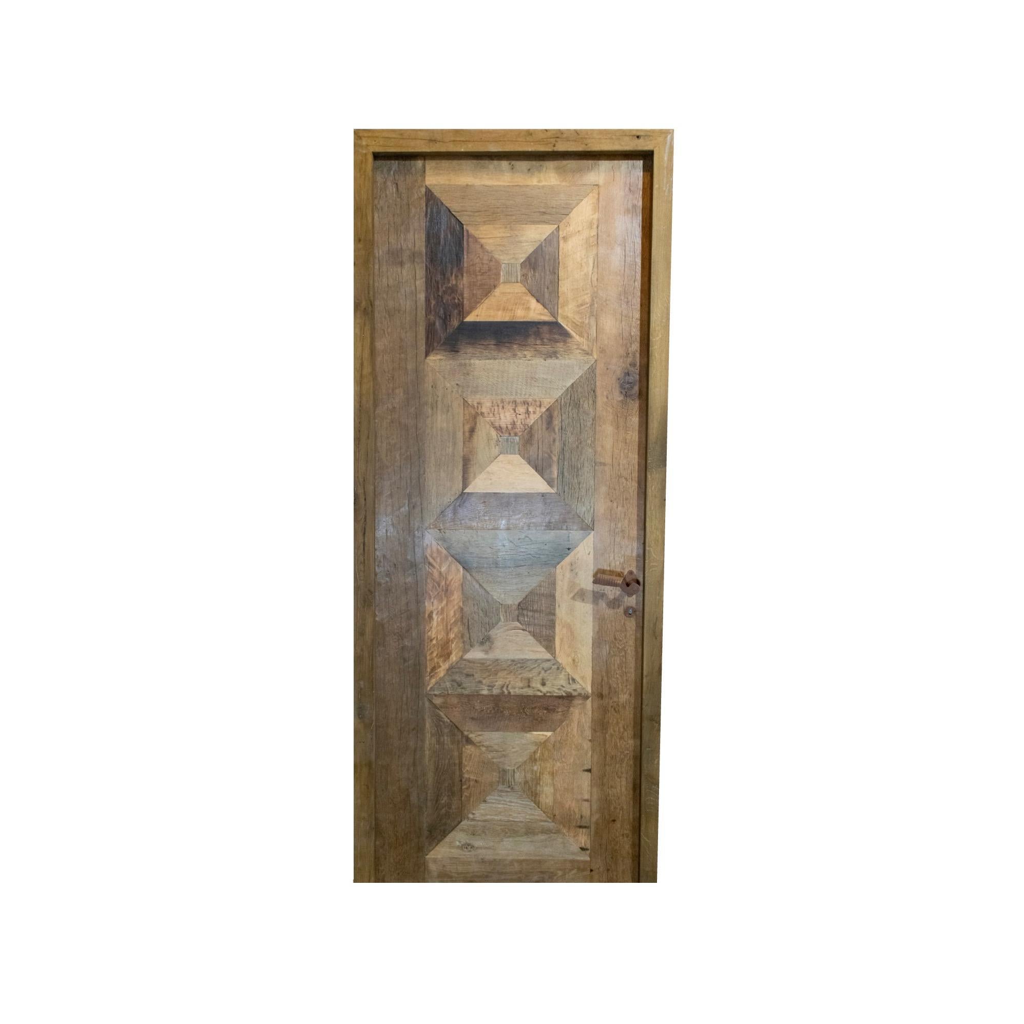 A reclaimed door made out of newly constructed Oakwood. Door is lock ready and comes with a key. Circa, 18th century. 

Reclaimed rustic doors are doors made from used materials that have been refurbished and given a new purpose. They often have a