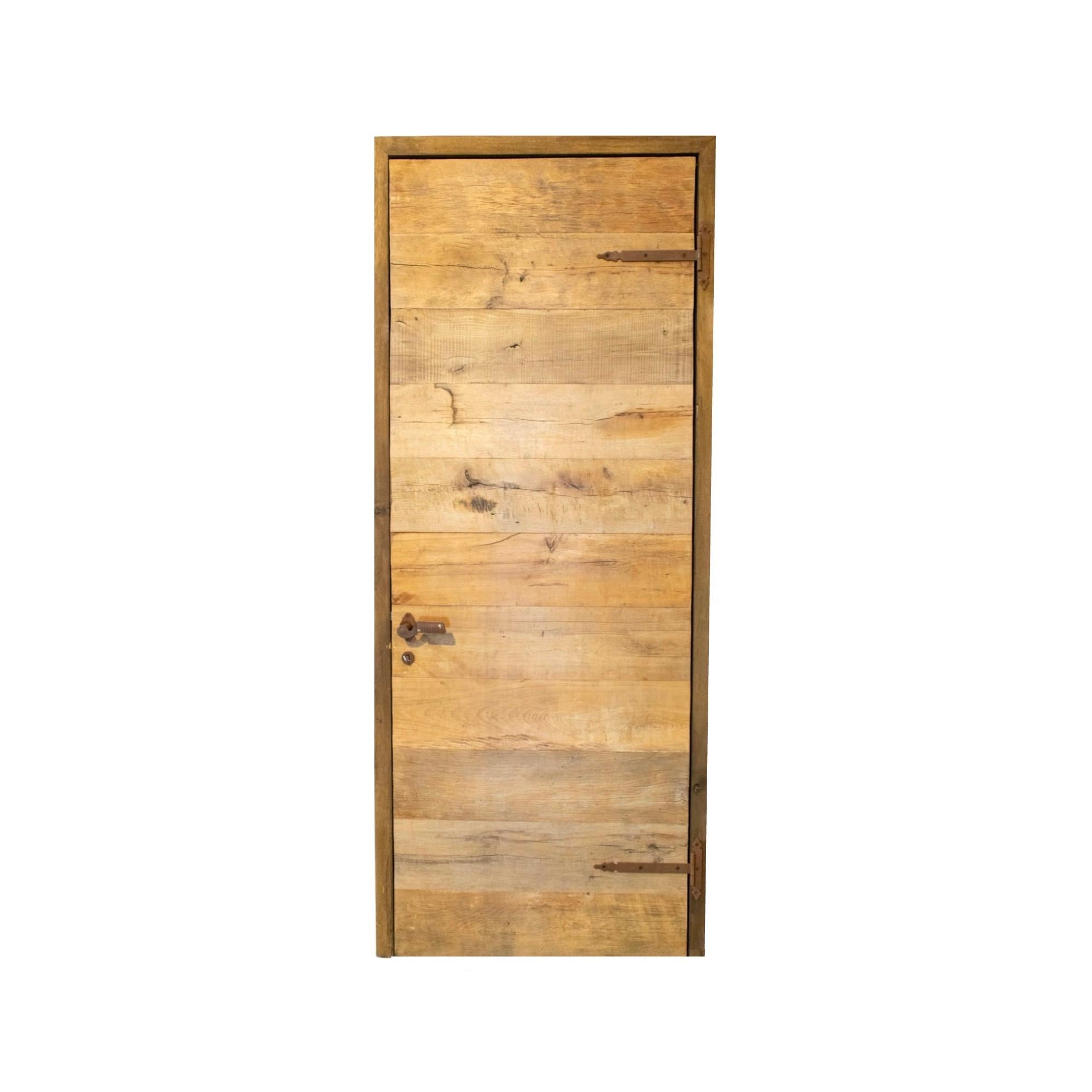 A reclaimed door made out of newly constructed oakwood. Door is lock ready and comes with a key. Circa, 18th century. 

Reclaimed rustic doors are doors made from used materials that have been refurbished and given a new purpose. They often have a