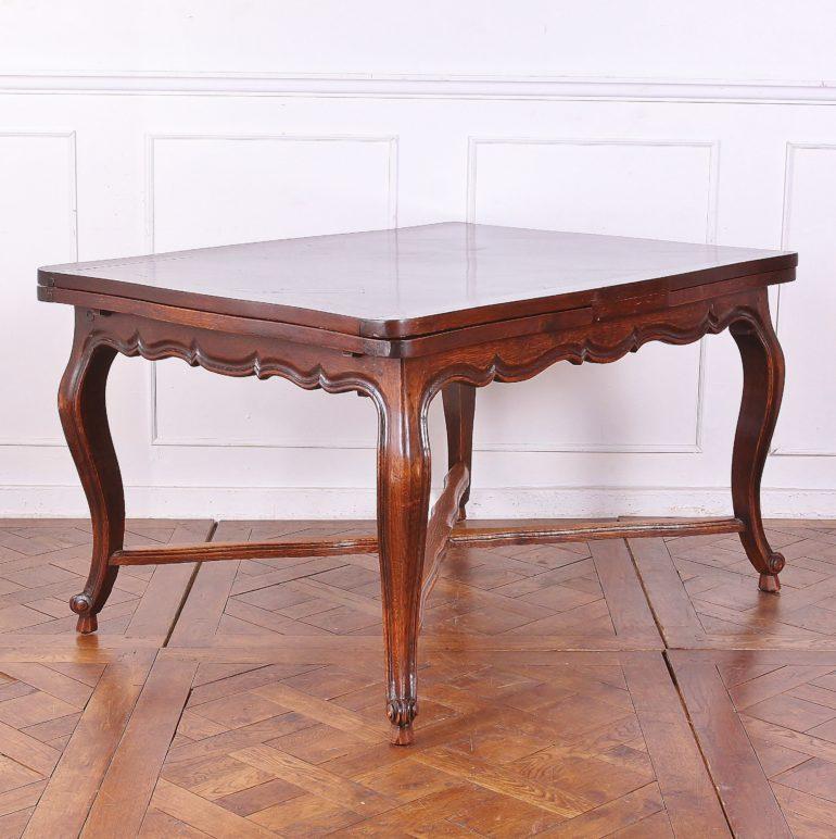 French oak draw-leaf table. Top recently professionally refinished to a beautiful, rich patina. 

Measures: 50.5 inches Wide (Closed) x 90 inches Wide (Open) x 38.5 inches Deep x 30 inches Tall.

 
