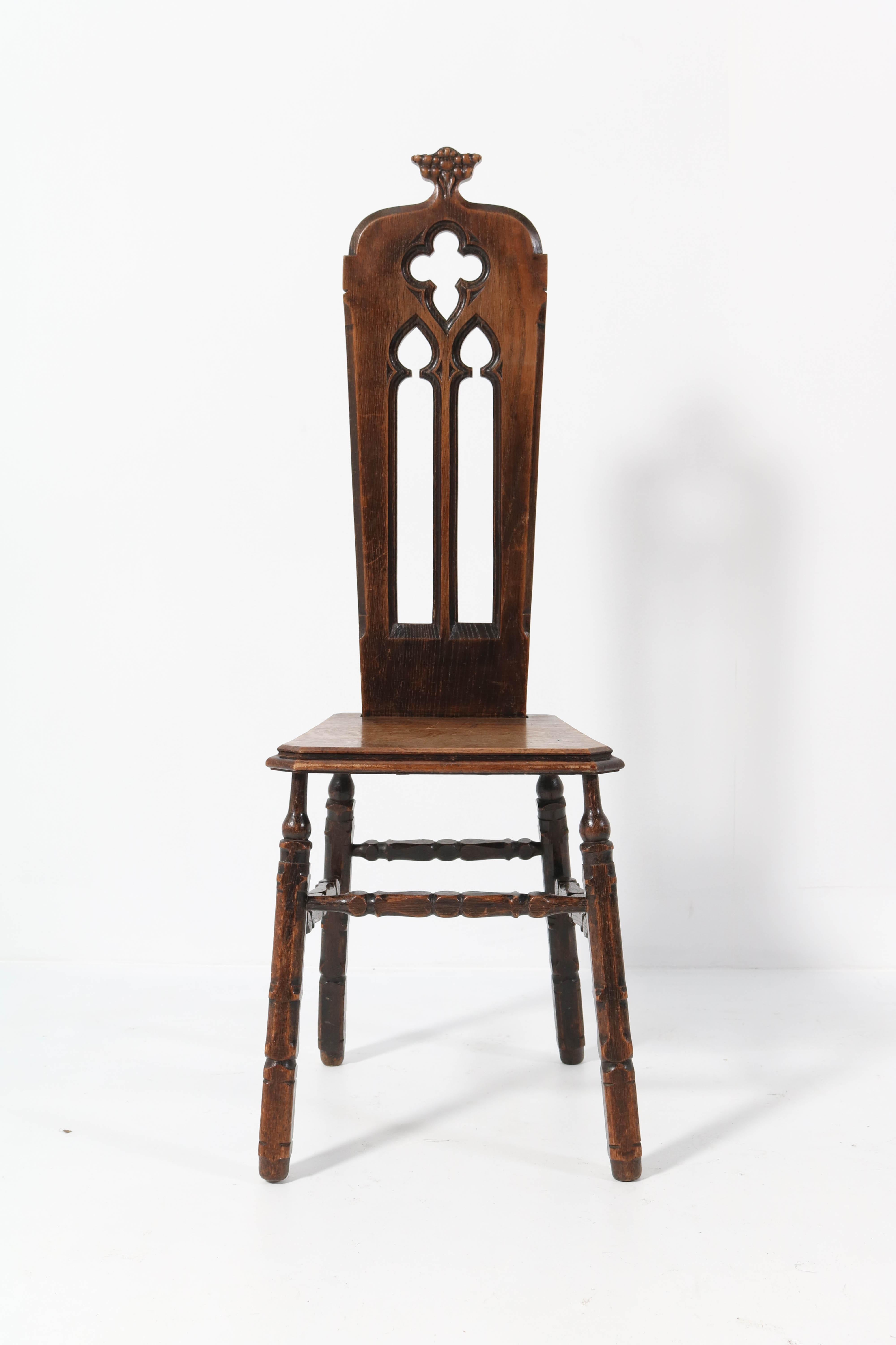 Wonderful Gothic Revival side chair.
Striking French design from the 1920s.
Solid oak with hand carved details.
In very good condition with minor wear consistent with age and use,
preserving a beautiful patina.