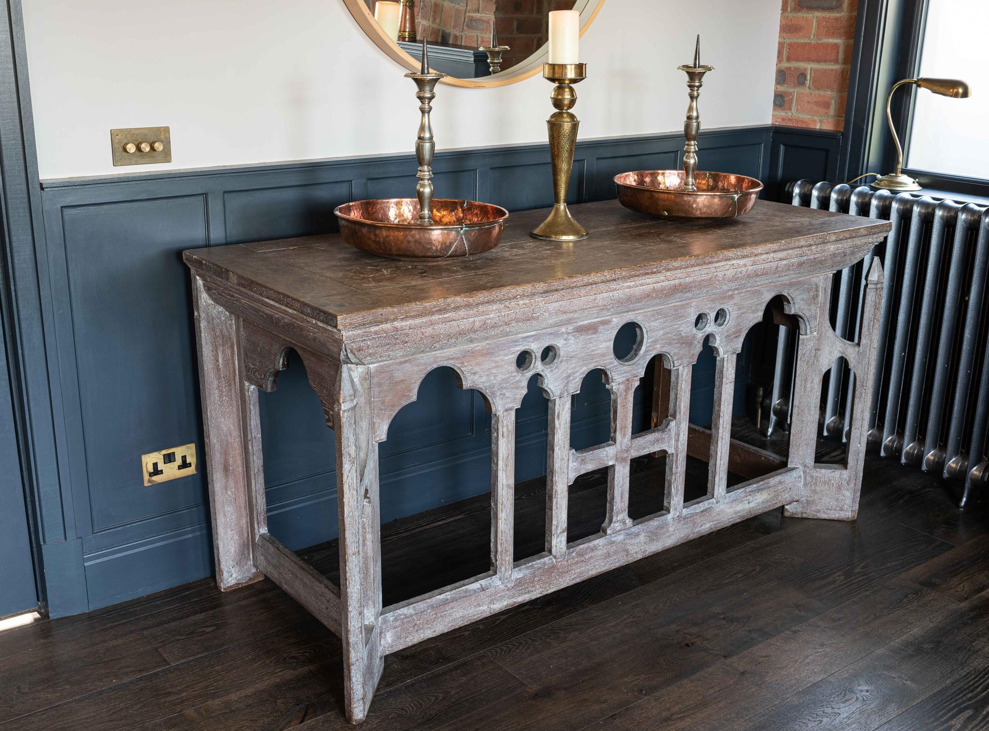 French oak limed Gothic alter table, circa 1880s

Would make a superb kitchen island or large serving table, or reception desk.
Table top is separate and lifts off the base to aid transportation

Measures: H 94, W 183, D 76CM.