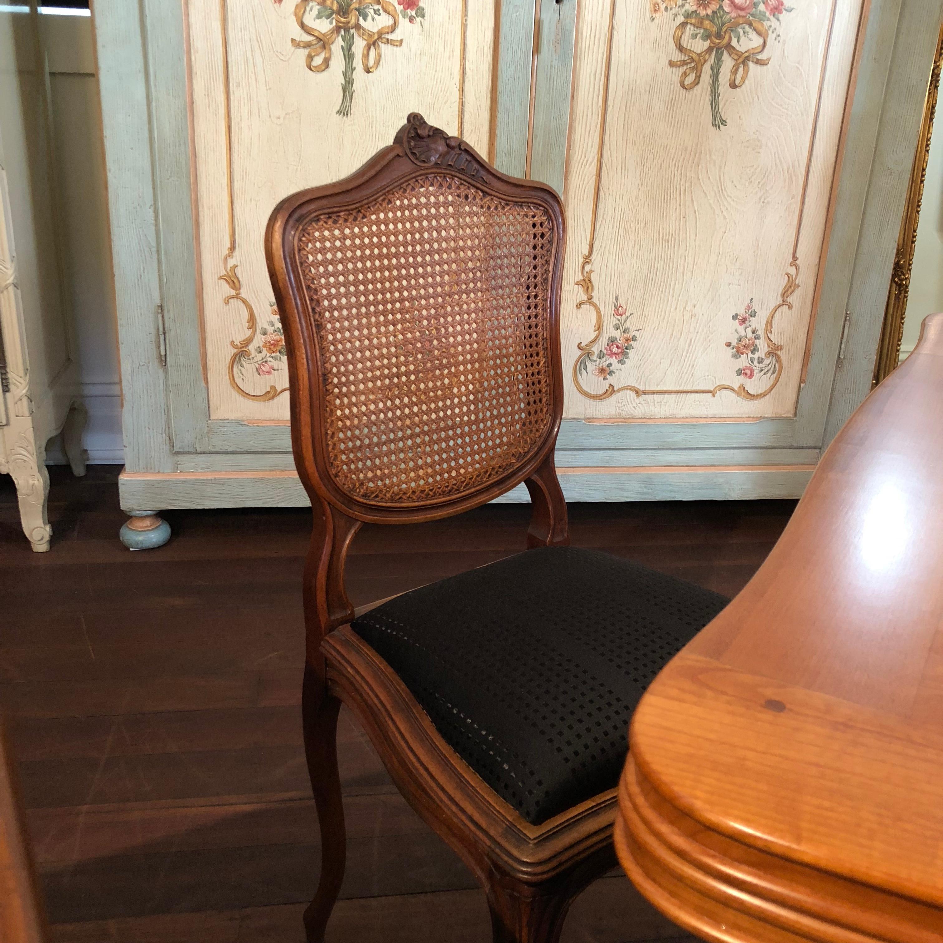 These magnificent Louis XV French Lattice dining chairs feature stylish noir modern upholstery and original lattice backs. They are dated at approximately circa 1880-1890 and have been crafted in the ever sophisticated Louis XV style, complete with