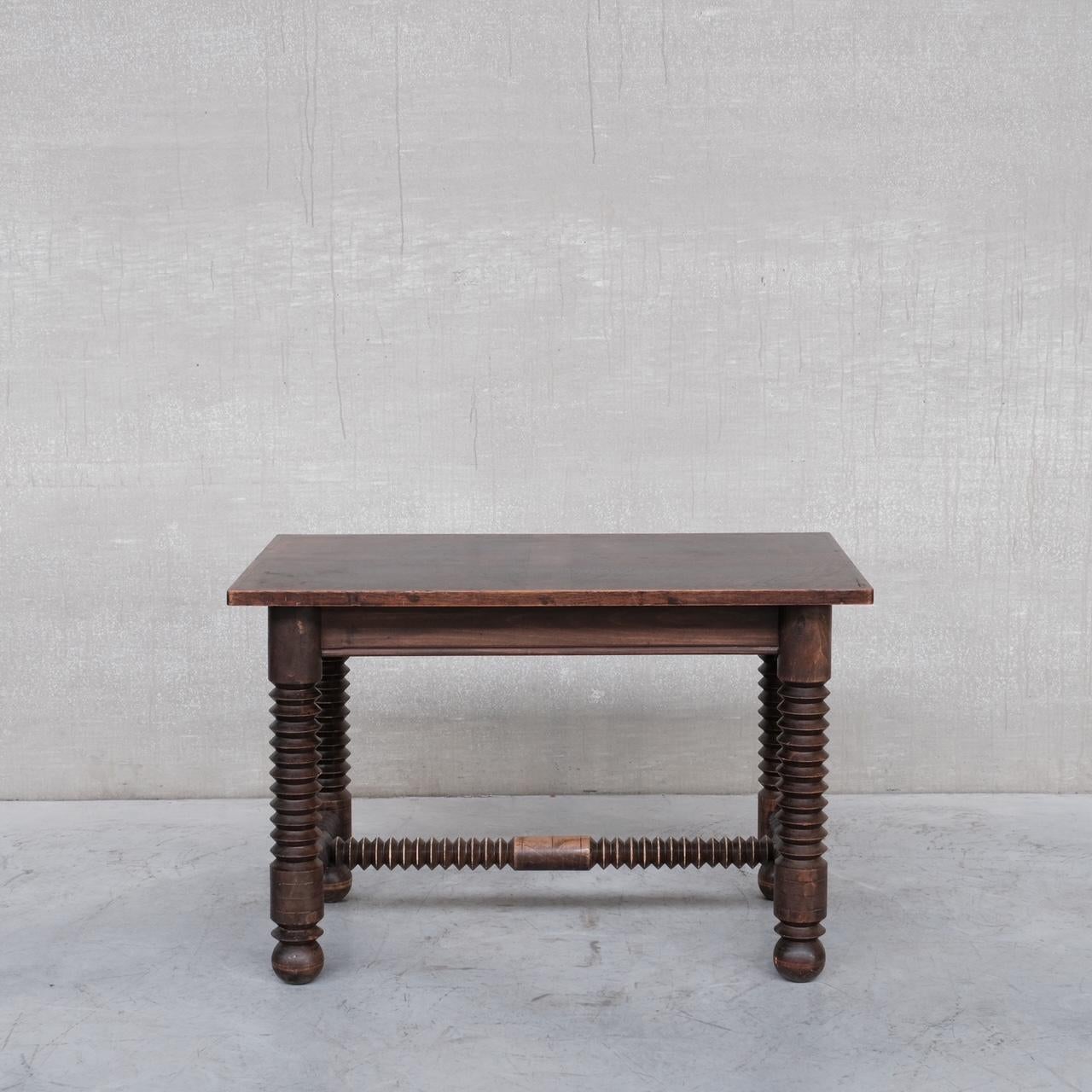 A good quality oak turned desk or petite table attributed to Charles Dudouyt. 

France, c1940-50s. 

A useful functional table that is enhanced by the decorative turned legs typical of Dudouyt's style. 

Remains in good vintage condition, some