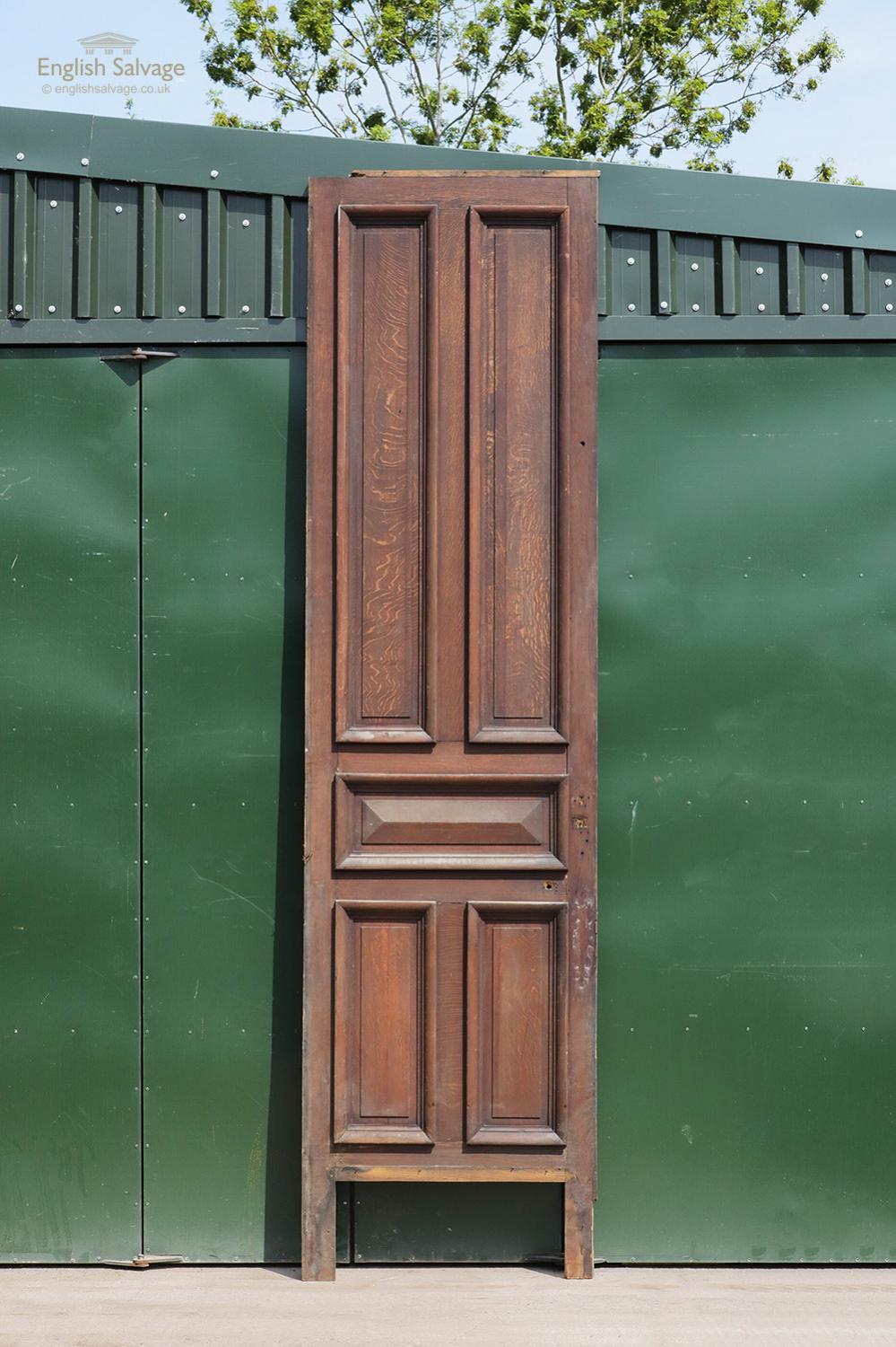 Reclaimed French oak panel or cupboard door with five beaded panels to the face and a plain, unfinished reverse. Width and height excludes small additional strips. Nails protruding, kick plate missing and some nail holes present.