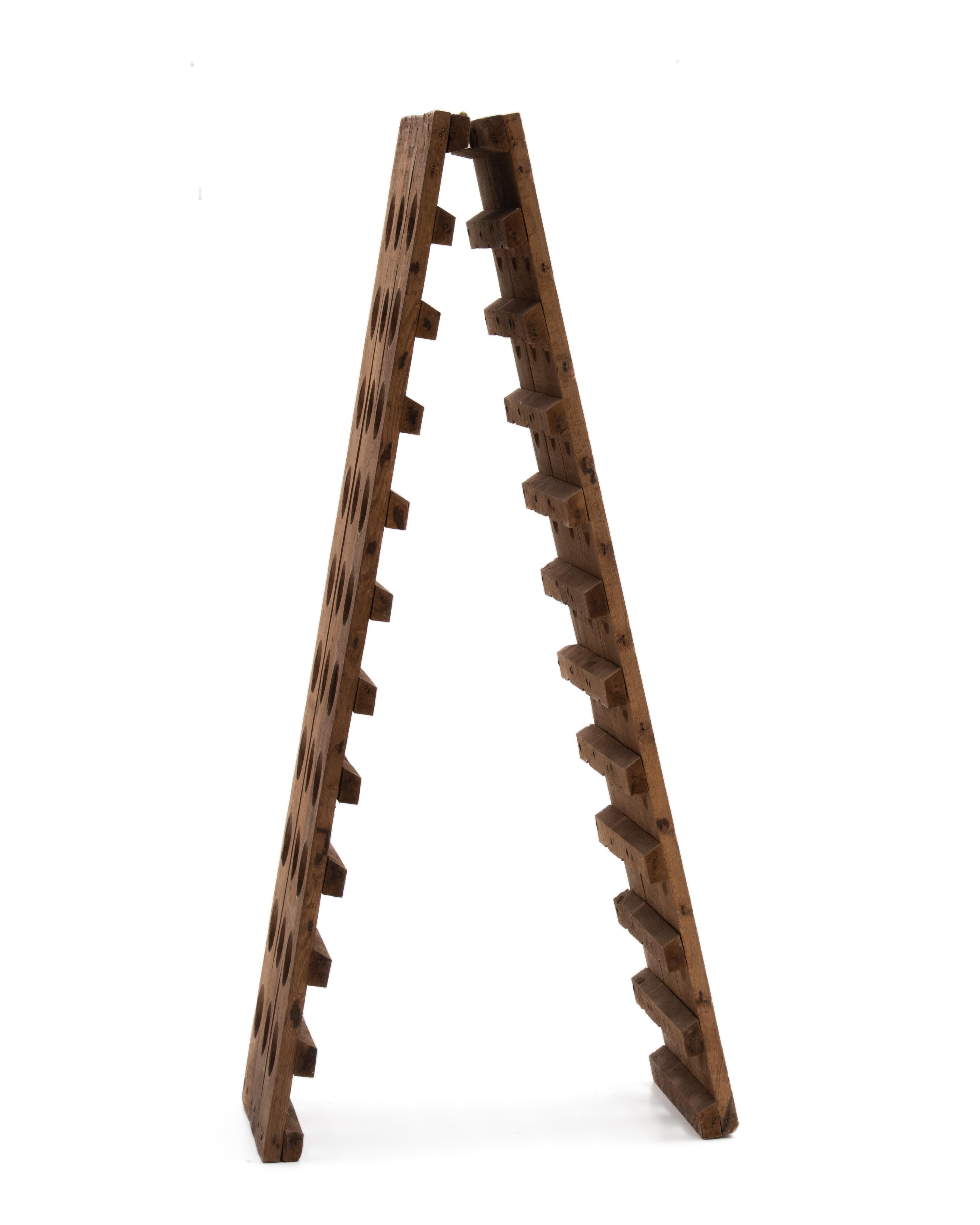 A great size French oak riddling rack, 30 bottles to each side for a total of 60 bottles. Wonderful patina. Marked 