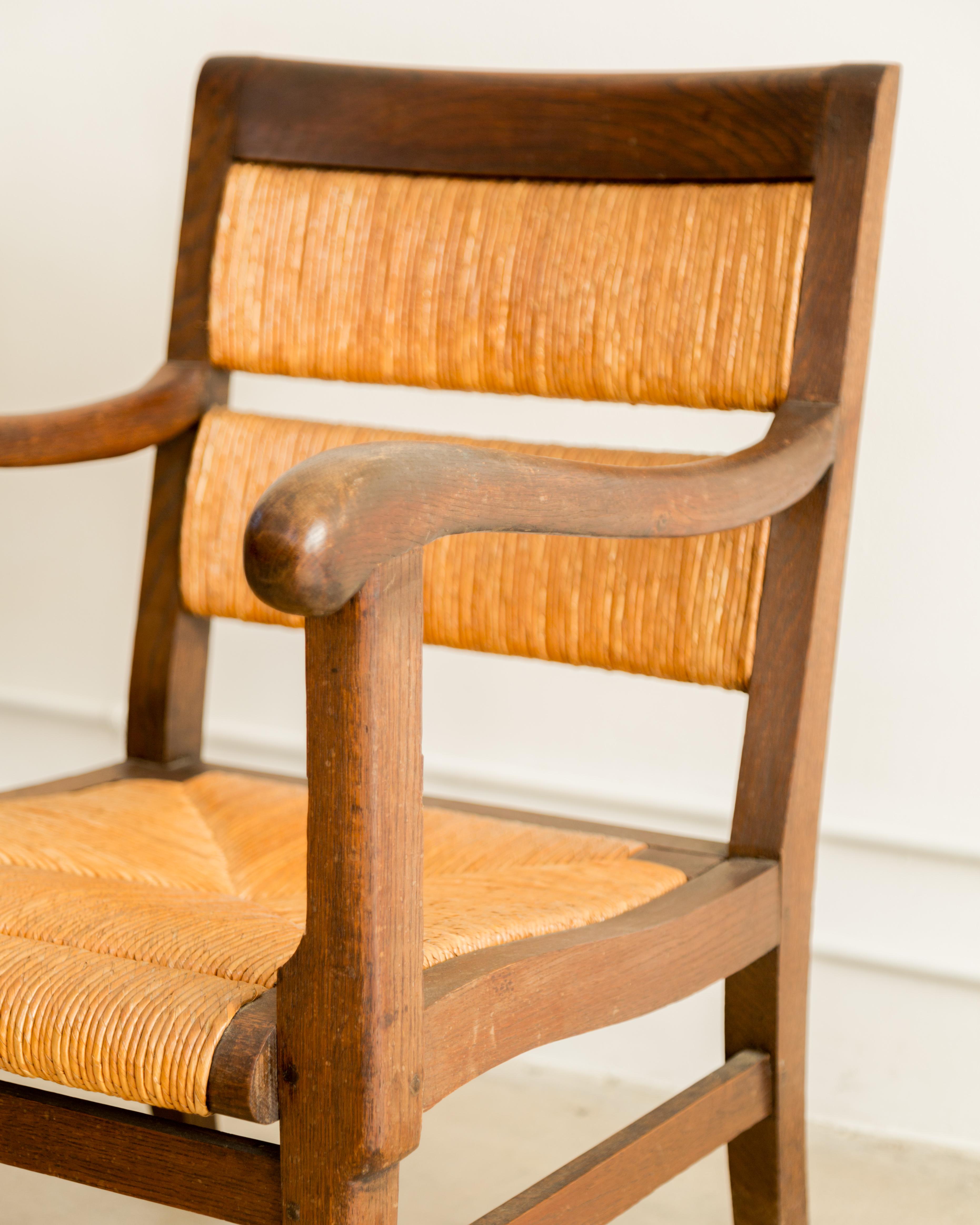 Oak + rush armchairs, rustic and refined with elegant lines and beautiful patina, France circa 1950's.