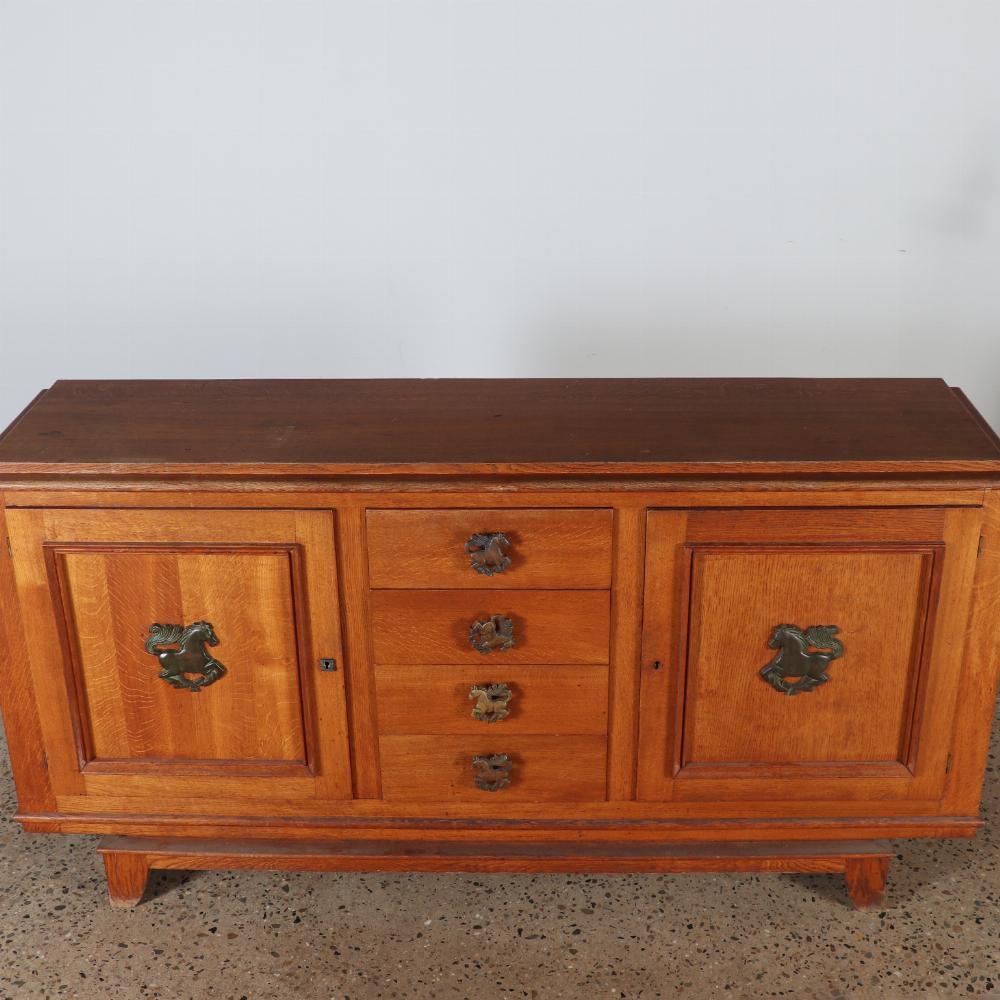 French oak sideboard circa 1940 having two doors and four drawers.  In Good Condition For Sale In Philadelphia, PA