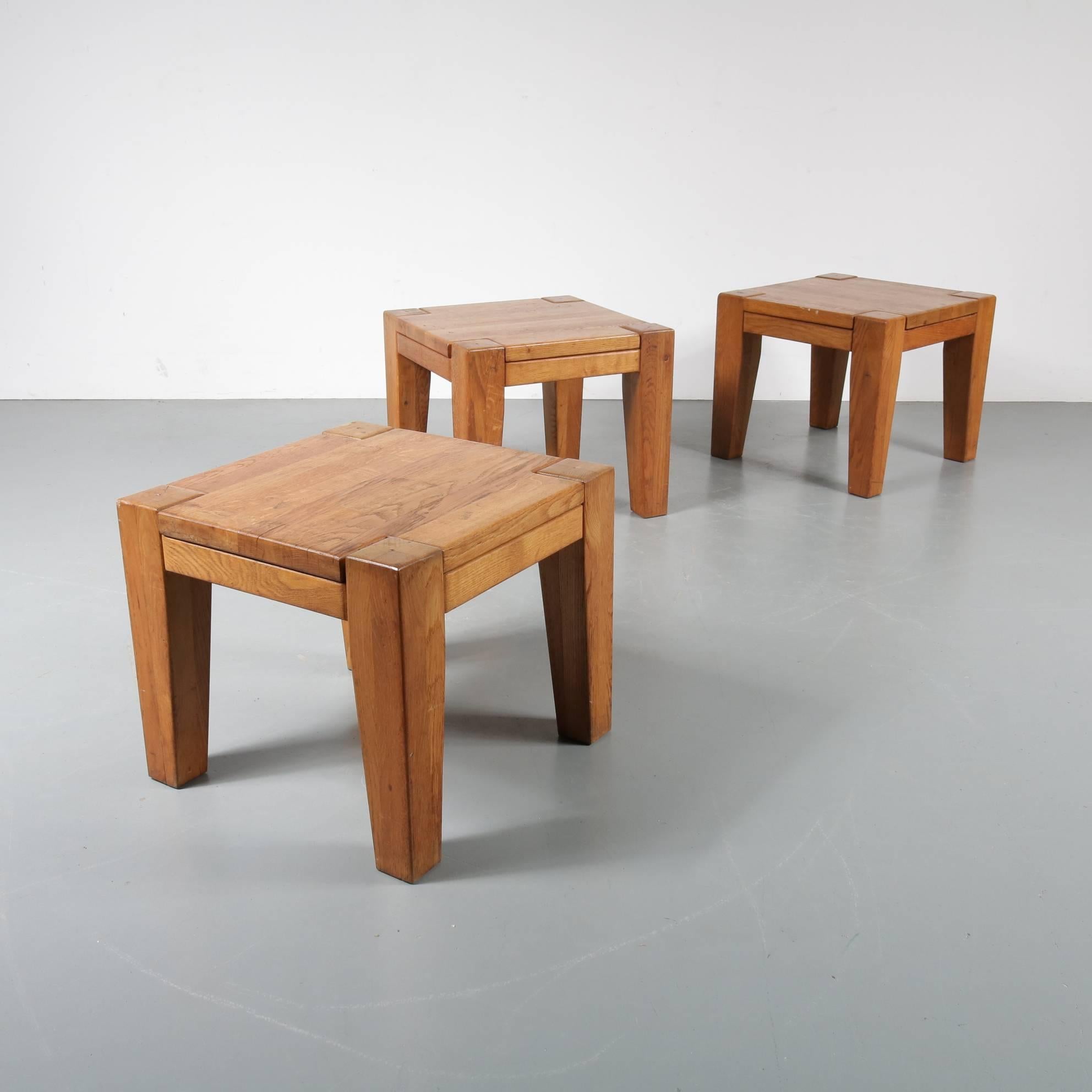 A beautiful set of three rustic stools or side tables, made in France, circa 1950.

These wonderful modern pieces are made of the highest quality solid oak wood. They have removable tops, adding versatility to their unique design. They would