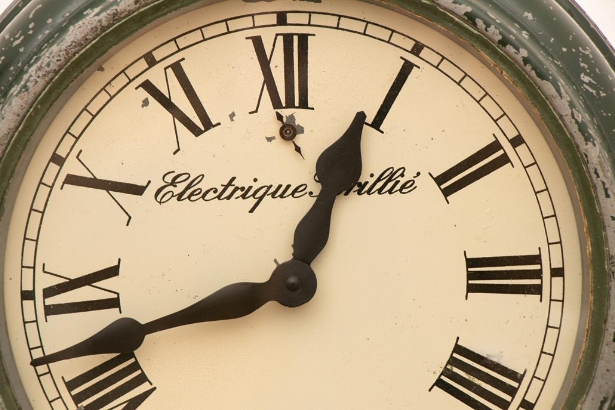 An original 1940s French office clock with natural wear and patina professionally converted to a hi-torque battery movement.