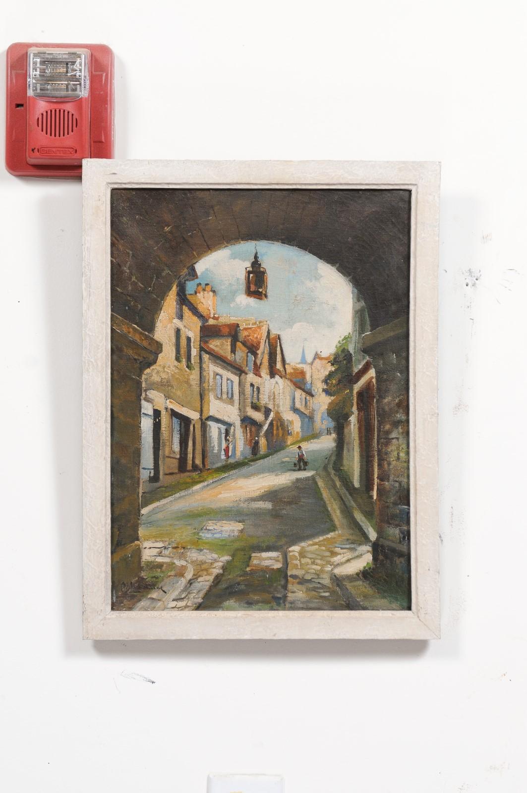 A French oil on canvas landscape painting from the 20th century, depicting the Petit Port de Dinan and set in wooden frame. Created in France during the 20th century, this landscape painting depicts the fortified town of Dinan, located in Brittany,