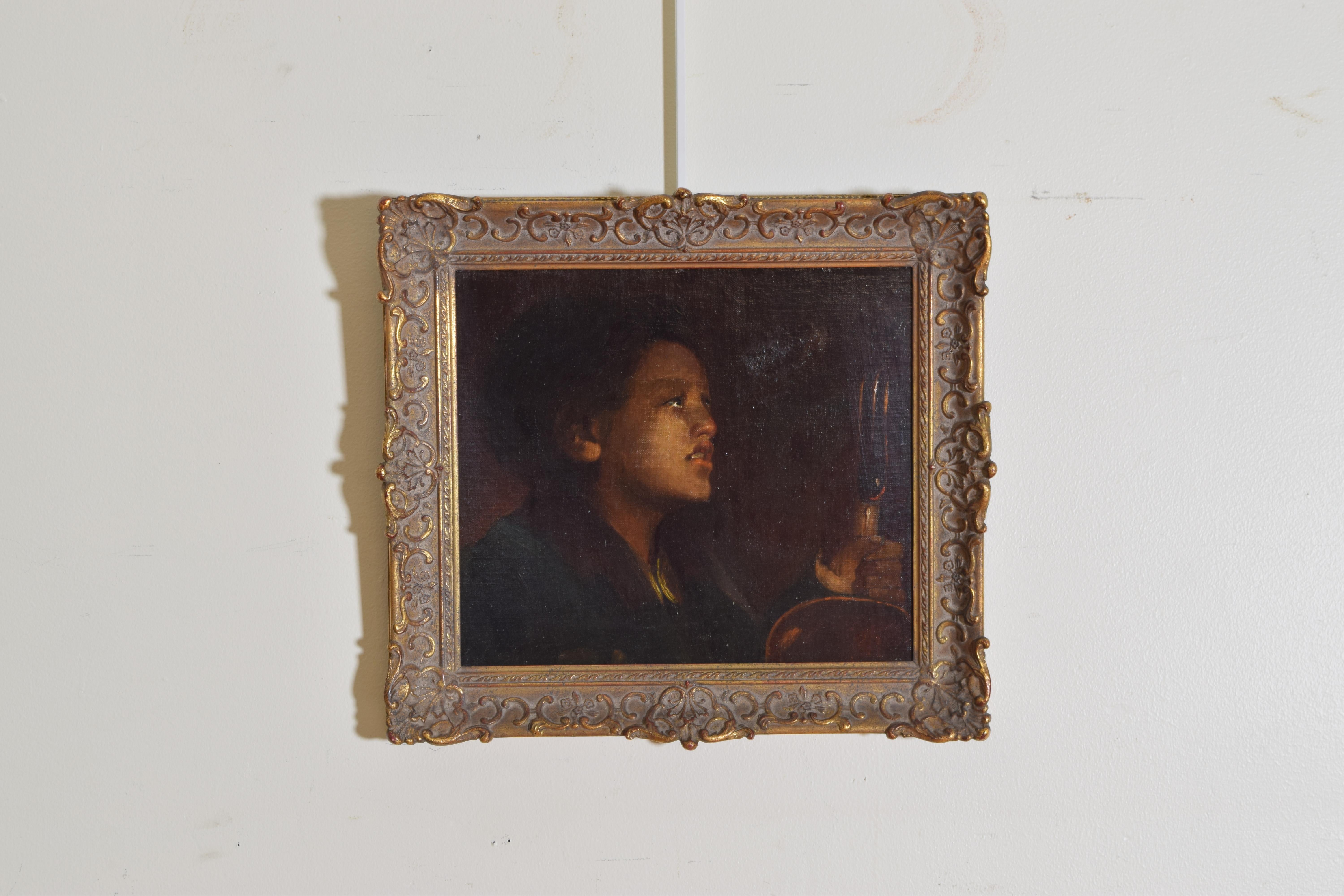 Depicing a genre scene in the Baroque style showing a dark vs light contrast imitated throughout the 18th and 19th centuries, placed in a later Regence style frame this oil on canvas is applied to a later board, the girl is holding an oil lamp and