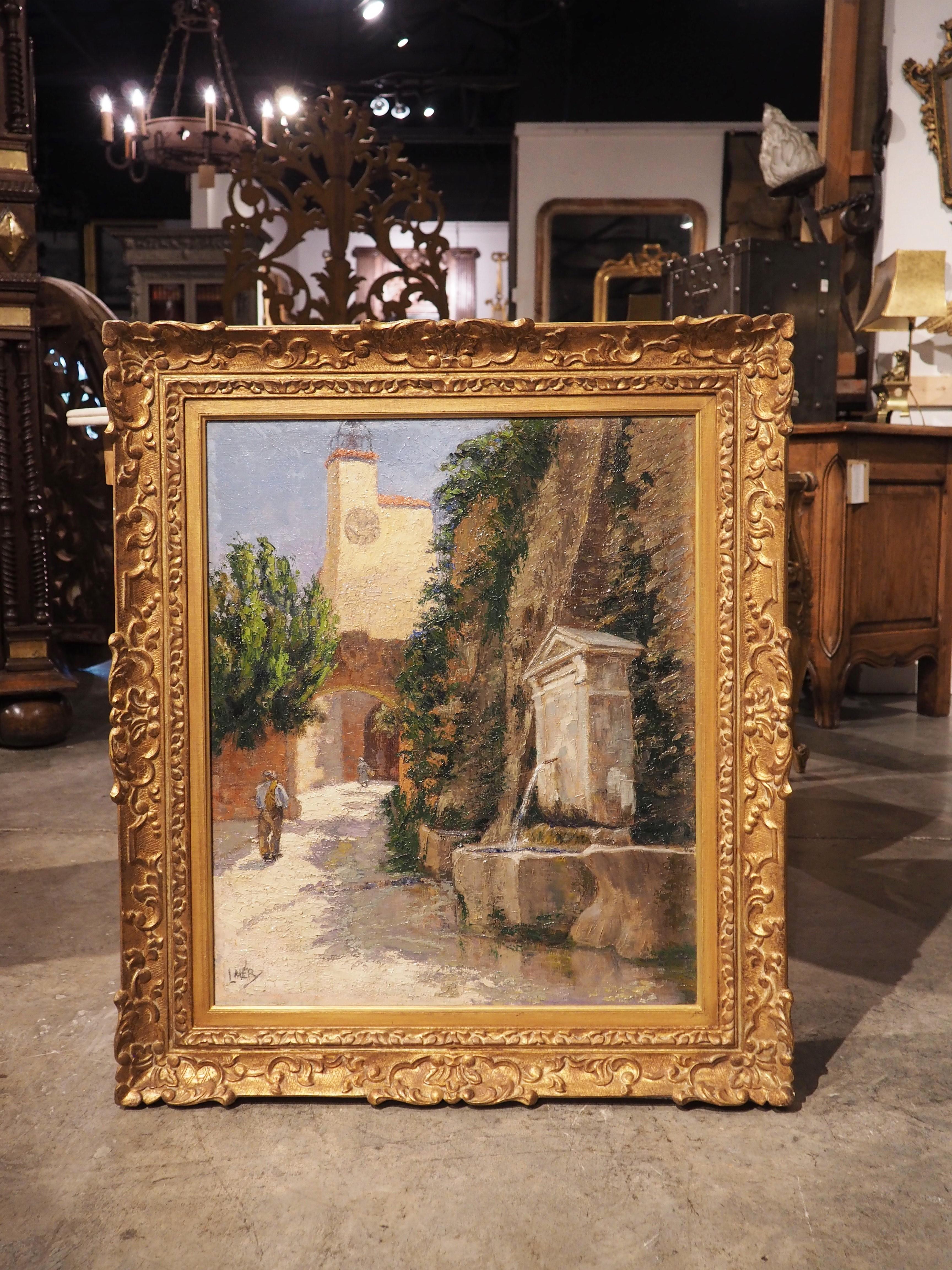 Signed in the lower left corner of the canvas by the artist, L. Mery, this vibrant painting depicts a street fountain in Provence, France. The verso side has also been inscribed, although the paint is too faint to discern. A stone wall fountain with
