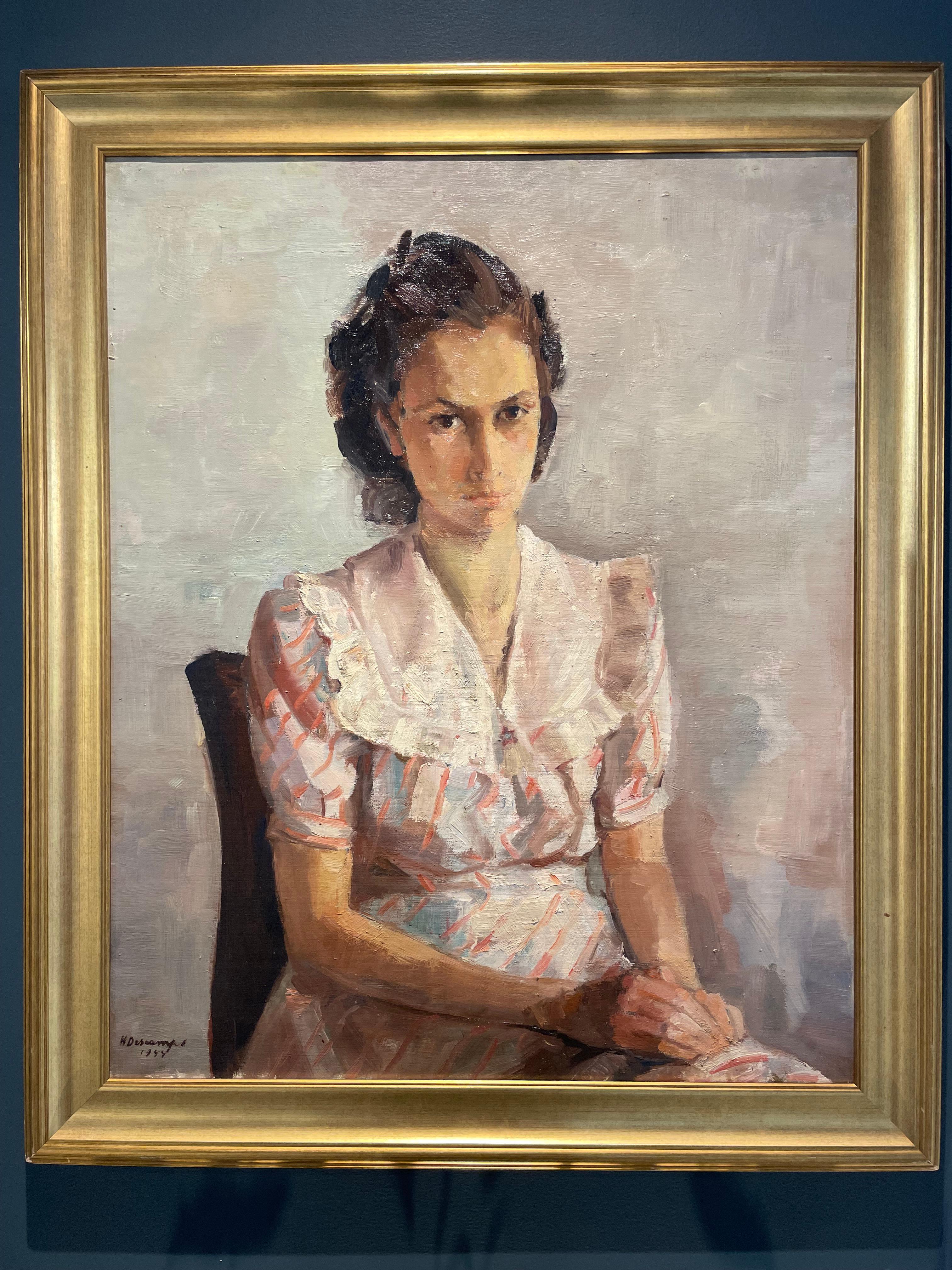 Portrait of the 20th century signed Henri Descamps (1898-1990) Young dark-haired girl seated wearing a white dress with shades of pink and blue with red stripes, hands crossed, and an intense and persistent gaze.
