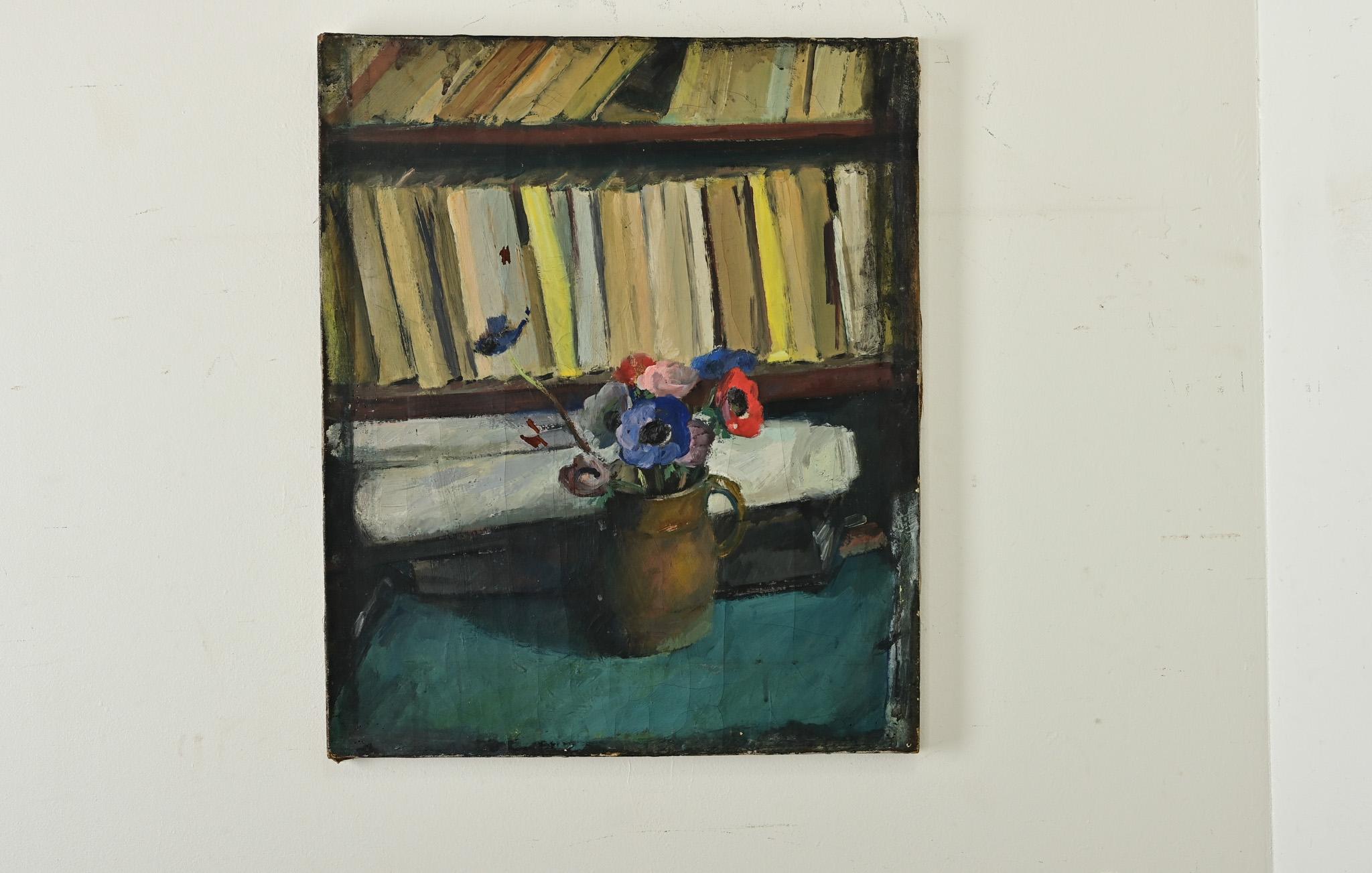 A delightful, unsigned French still life painting in oil on canvas capturing a moment of calm as a copper pitcher of anemones by a disorganized bibliotheque. Within the dimly lit scene, the royal blue poppies in the foreground are contrasted with