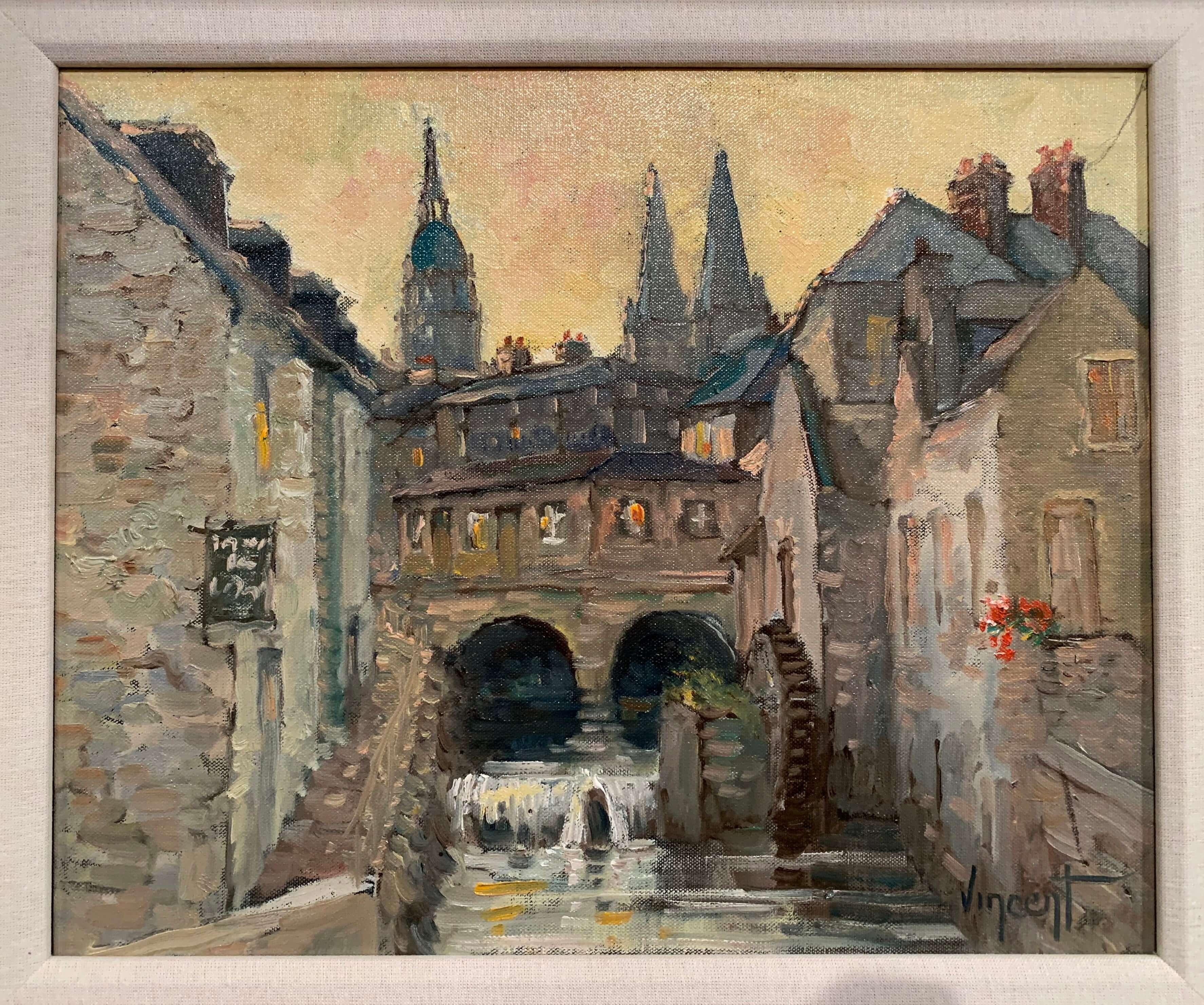 This French oil on canvas painting depicts an old mill in the city of Bayeux, Normandy. Set inside a carved, gilt frame, the composition exemplifies how architecture can be rendered in a painterly, impressionist style. The art work is signed in the