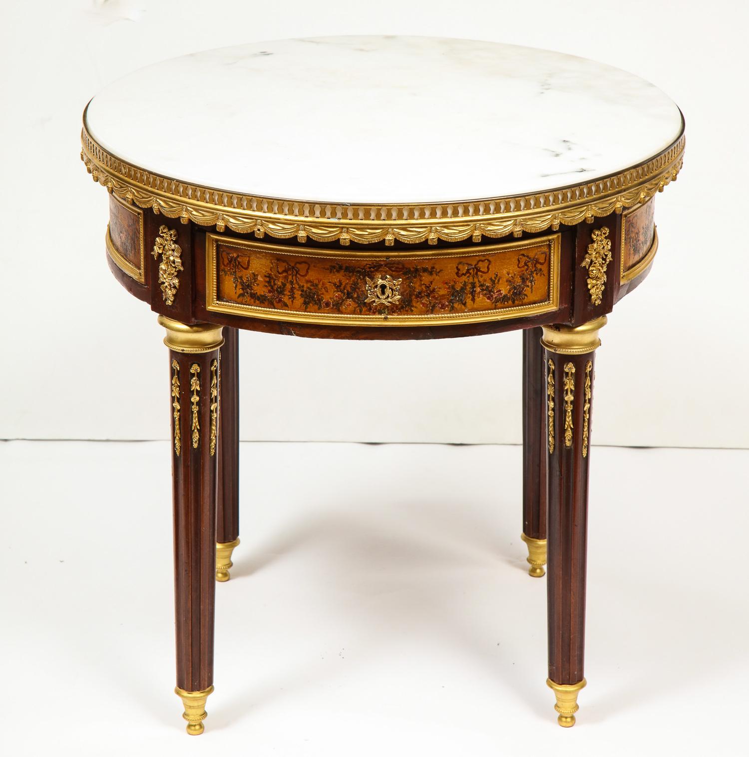 A French ormolu bronze and Vernis Martin low-table gueridon with marble top, circa 1880.

Very fine quality mounts, and good quality vernis martin paintings, with original white marble top, with a single drawer.

Measures: 20.5