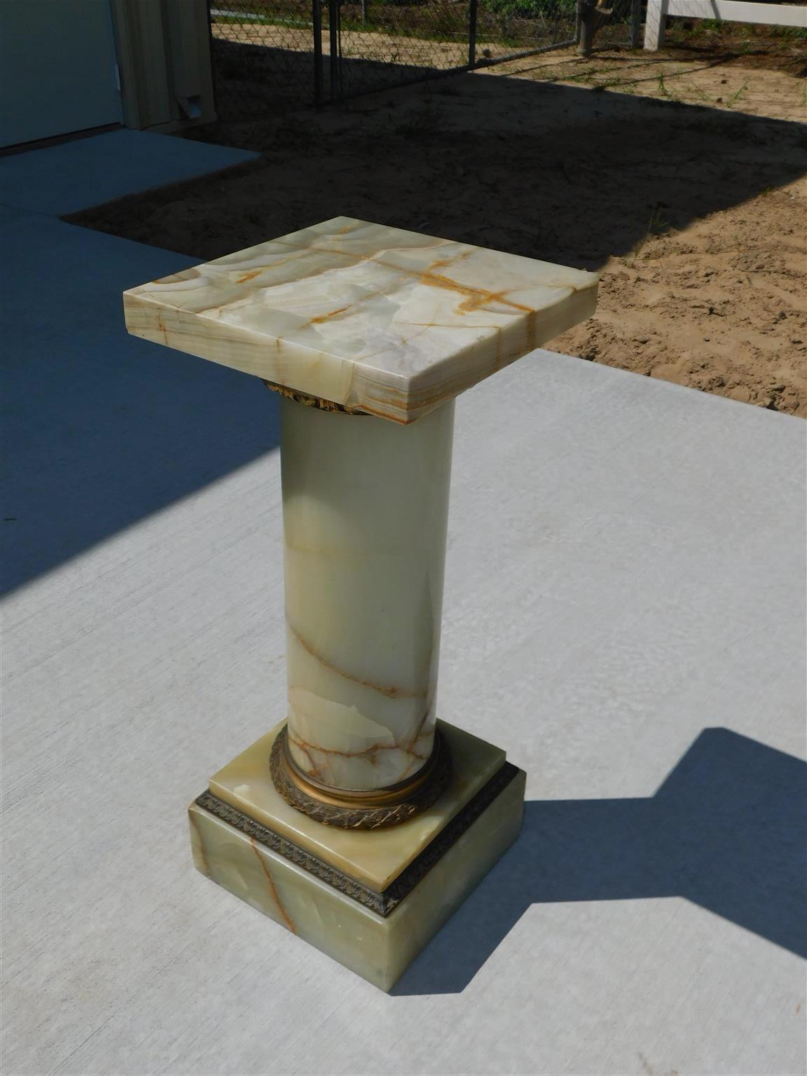 French onyx and gilt bronze garden pedestal with a squared foliage bronze collar top, central turned column support, and resting on a squared foliage bronze collar base, Mid 19th Century