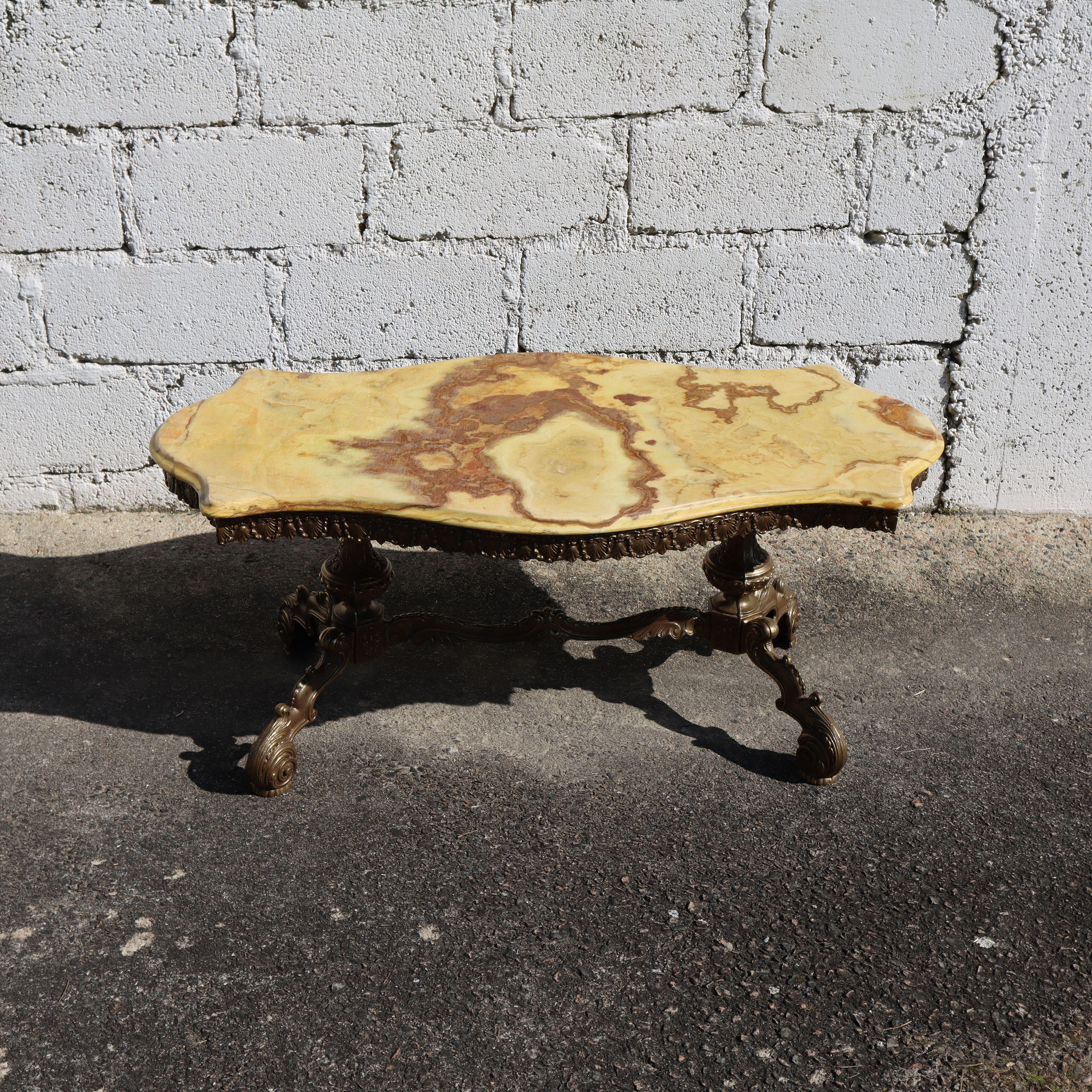 French Vintage big Marble Bronze Coffee Table-Vintage Lounge Table Rococo Style from the 60s
Elegant Tabletop Shape - splendid Colors - Clouds in different Shades of yellow,cognac,orange with natural Pattern and decorative Edge all around .
Massive