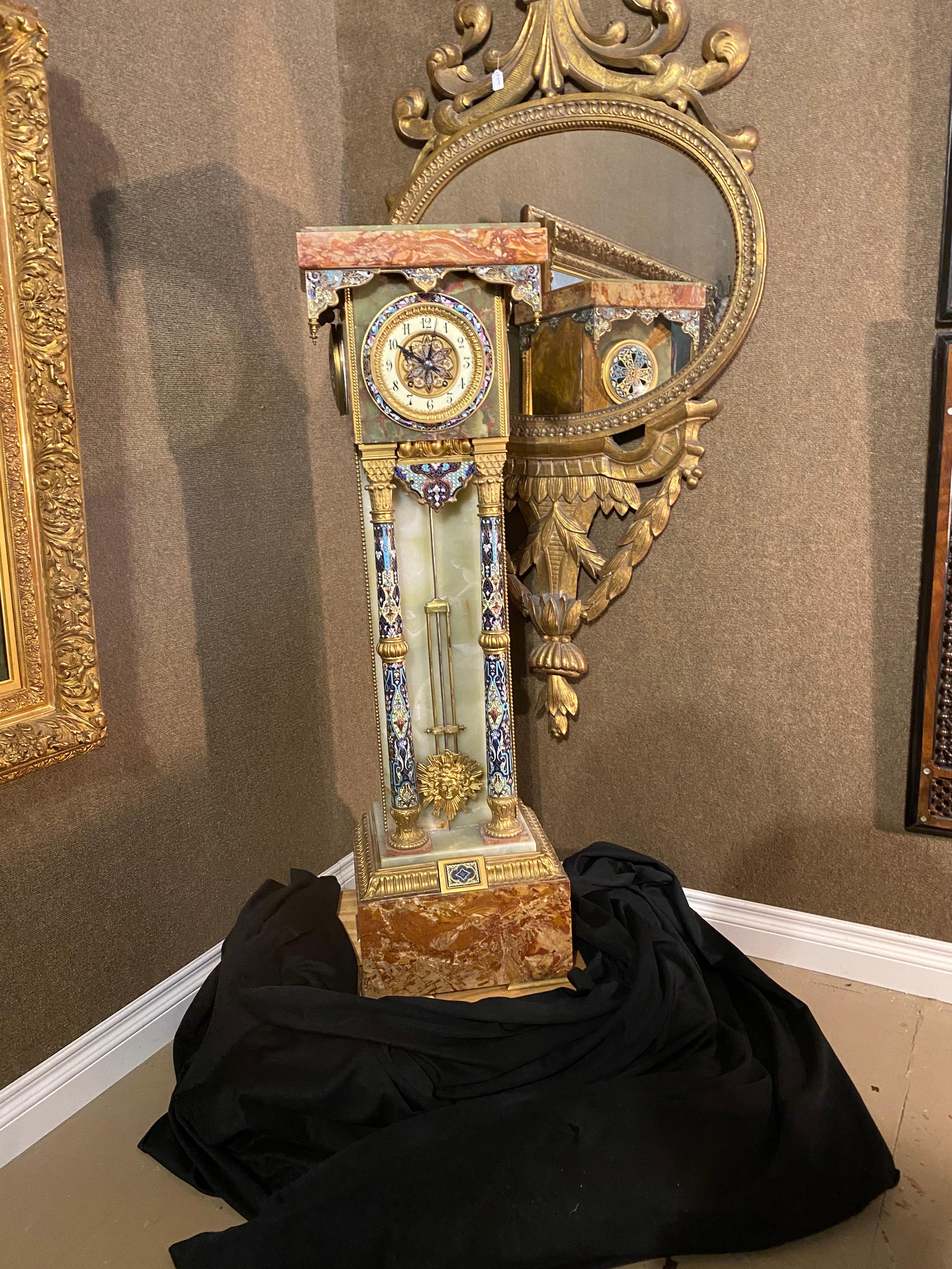 French onyx, marble, gilt bronze & Champlevé enamel Islamic style pedestal clock, retailed by Tiffany & Co. Having Arabic numerals on the ivory colored porcelain dial with a centered enameled medallion. The clock movement stamped Tiffany and Co 443,